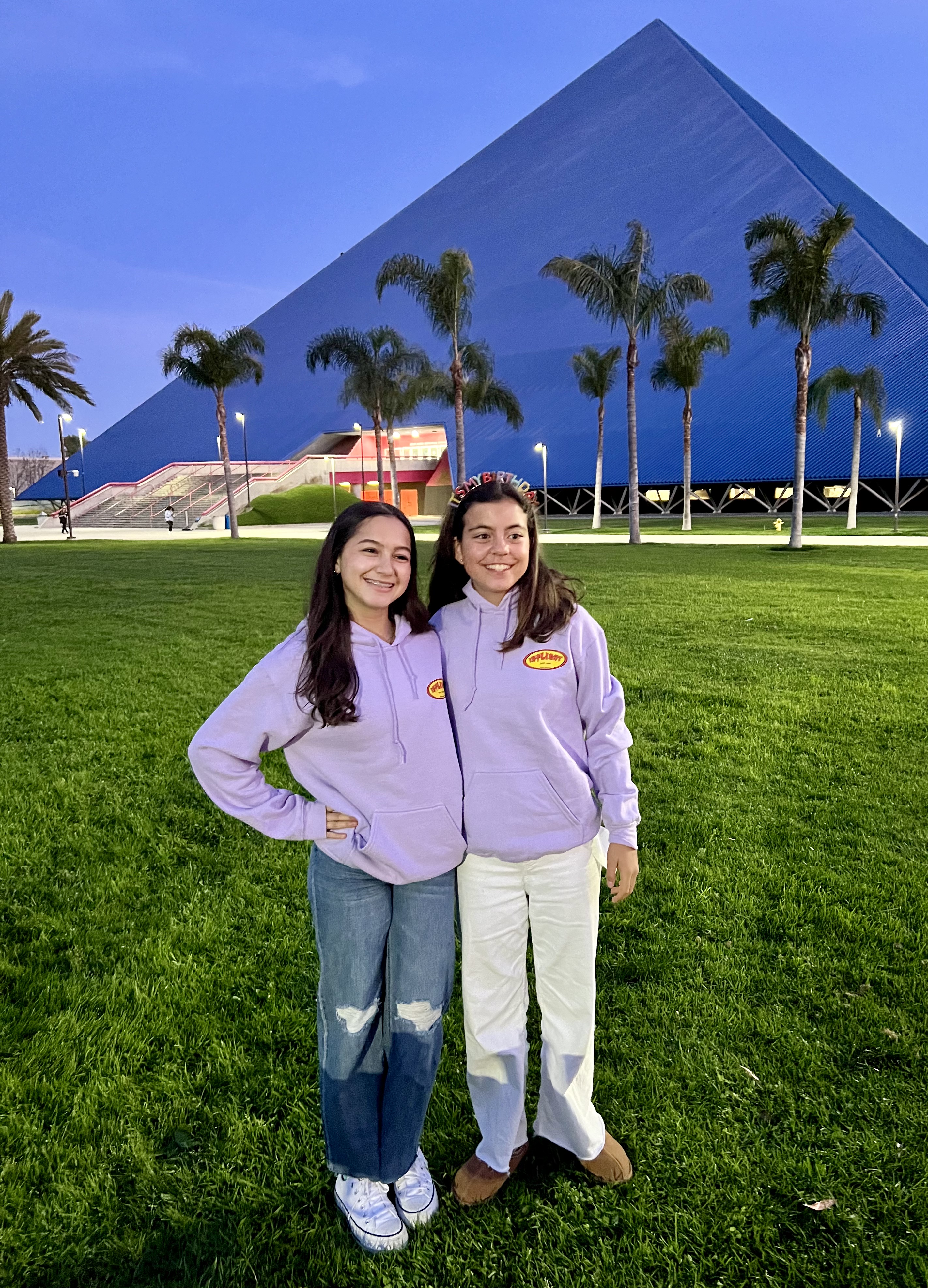 Img: female, girl, person, teen, pants, grass, tree, shoe, jeans, people