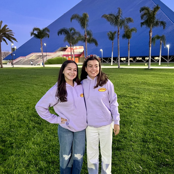 Img: female, girl, person, teen, pants, grass, tree, shoe, jeans, people