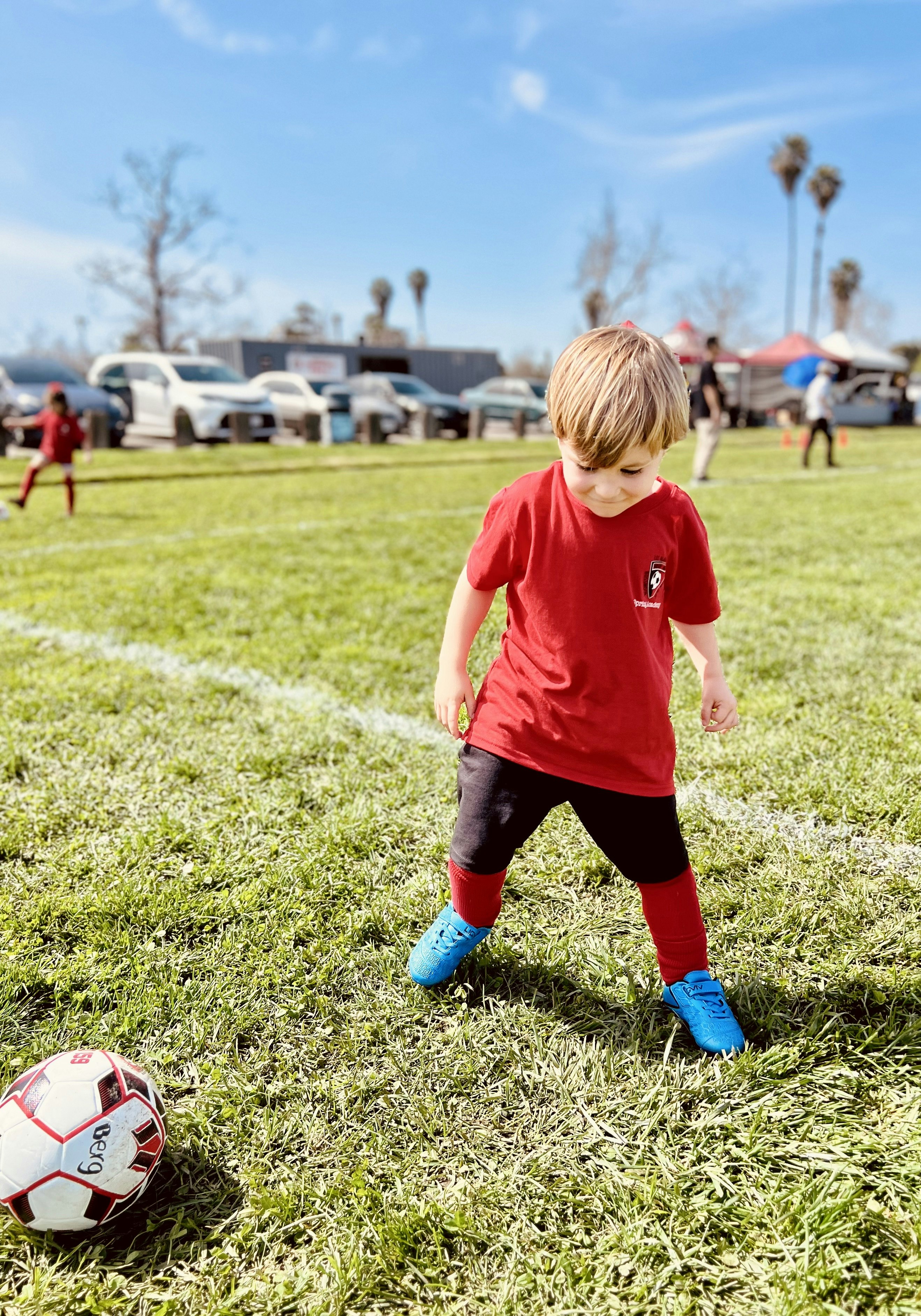 Img: soccer, soccer ball, sport, sphere, boy, child, male, person, car, vehicle