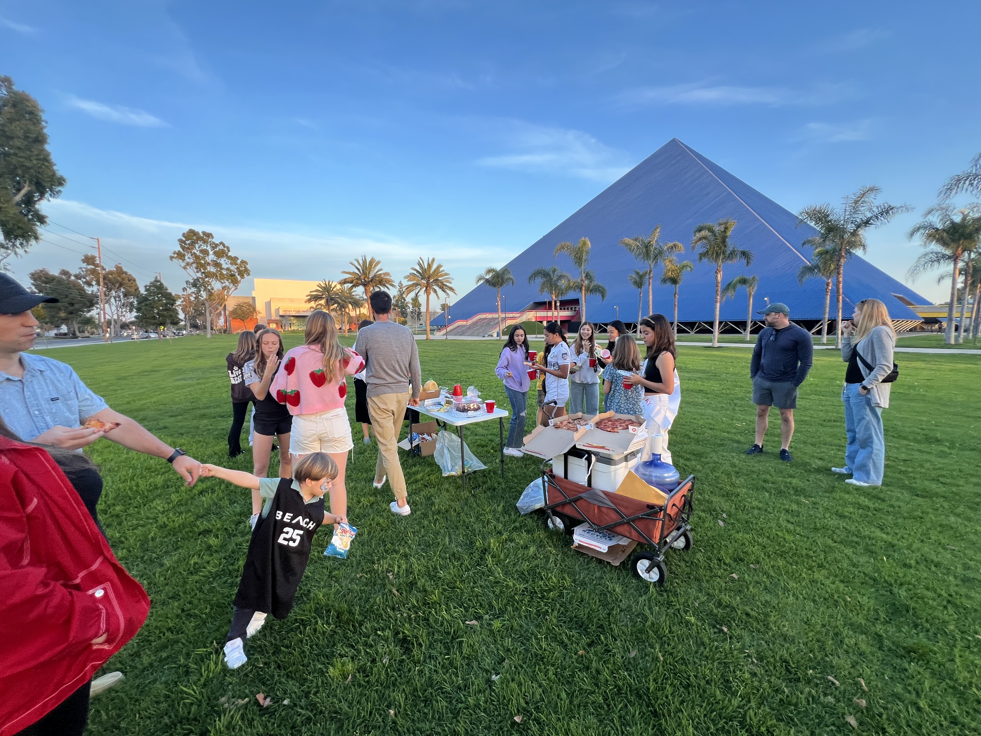 Img: grass, people, person, hat, shoe, cup, adult, male, man, summer