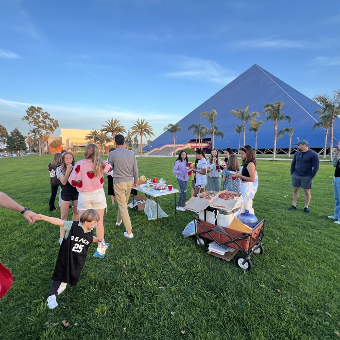 Img: grass, people, person, hat, shoe, cup, adult, male, man, summer
