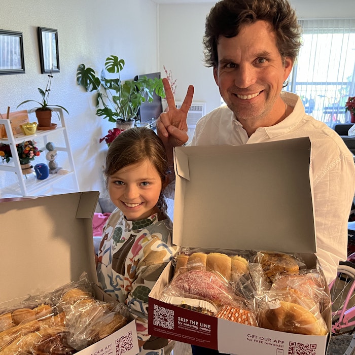 Img: laptop, bread, adult, male, man, person, child, female, girl, box