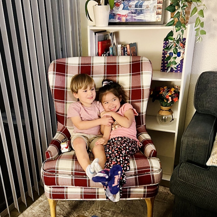 Img: person, portrait, potted plant, furniture, chair, cushion, living room, child, female, girl