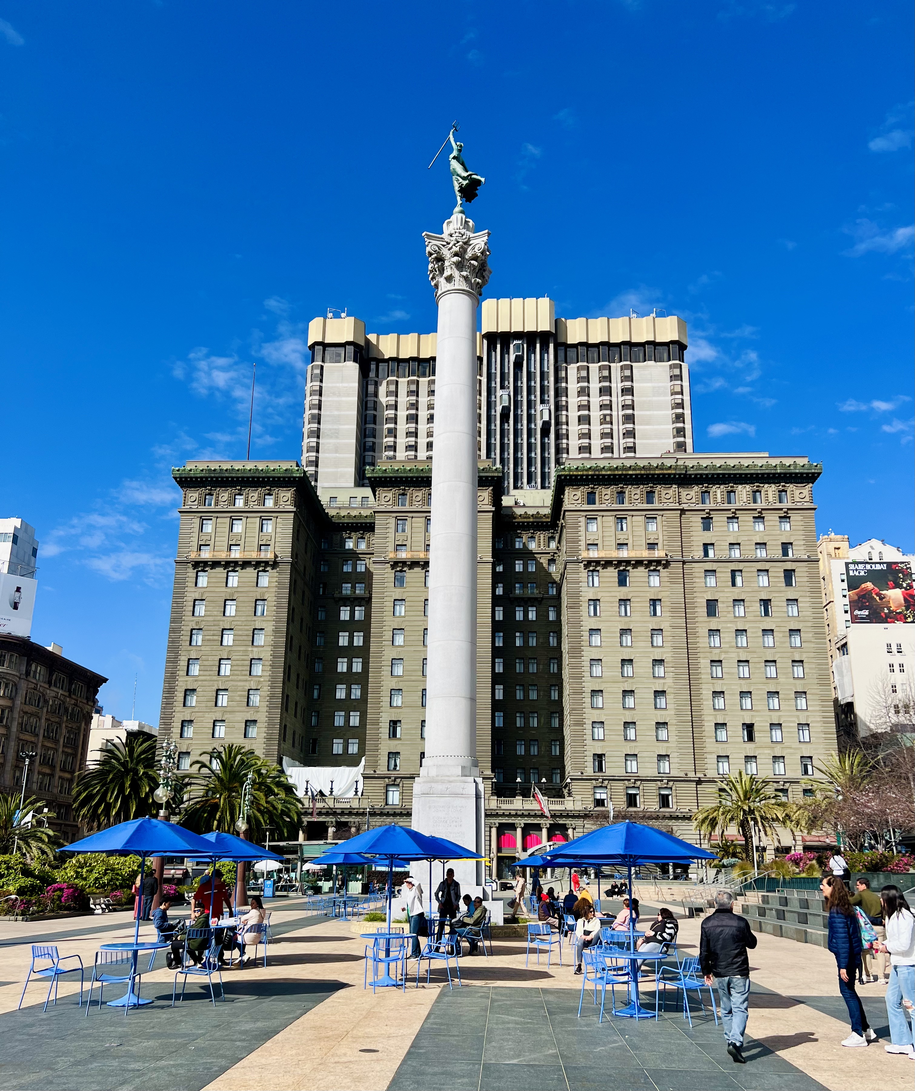 Img: city, urban, downtown, office building, metropolis, shoe, person, handbag, clock tower, high rise