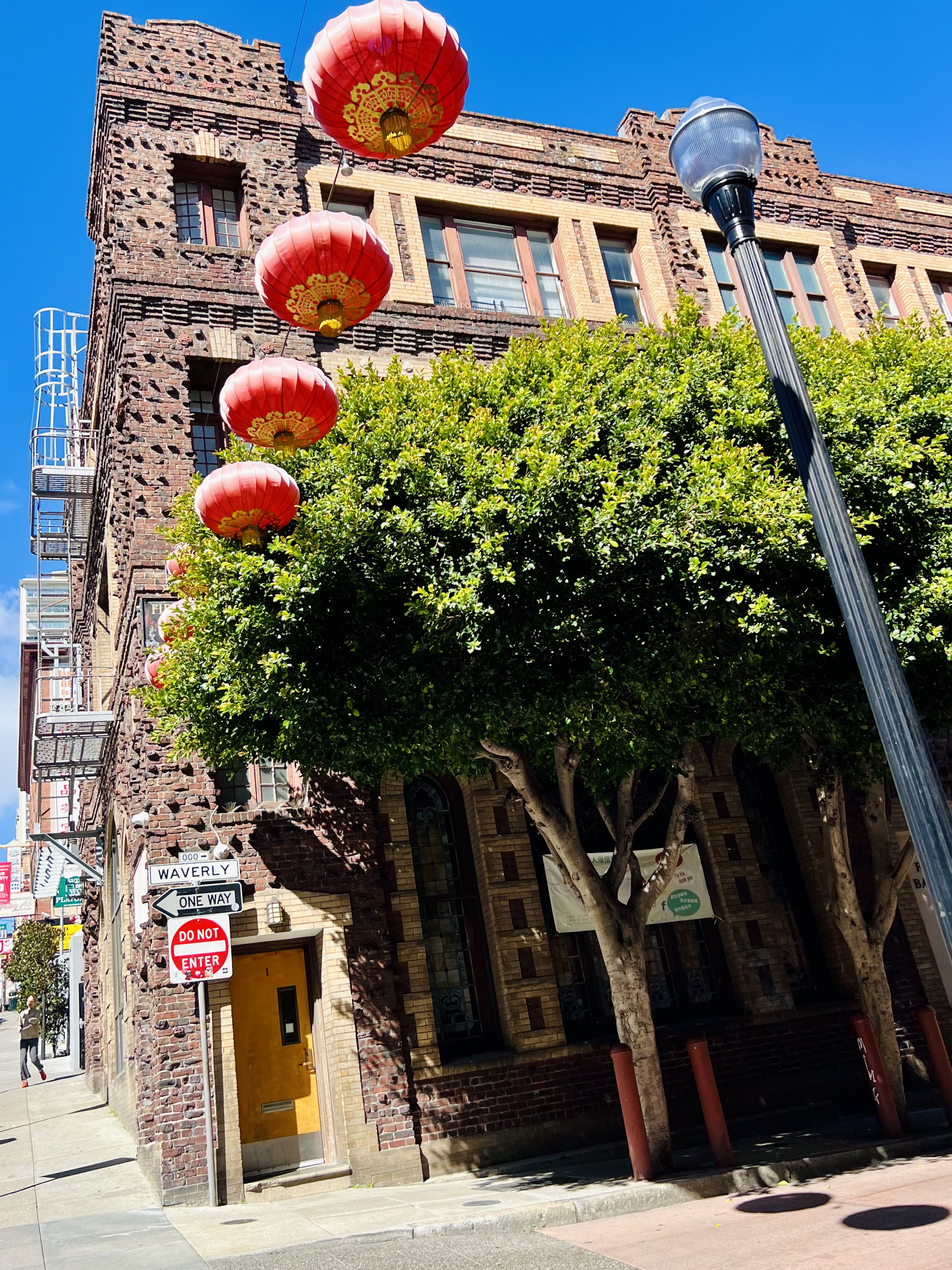 Img: path, walkway, city, flagstone, person, urban, lamp, street, sign, lantern