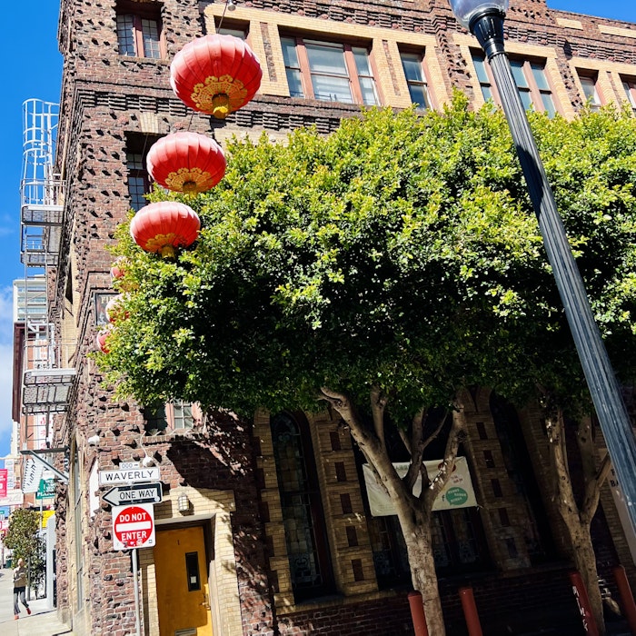 Img: path, walkway, city, flagstone, person, urban, lamp, street, sign, lantern