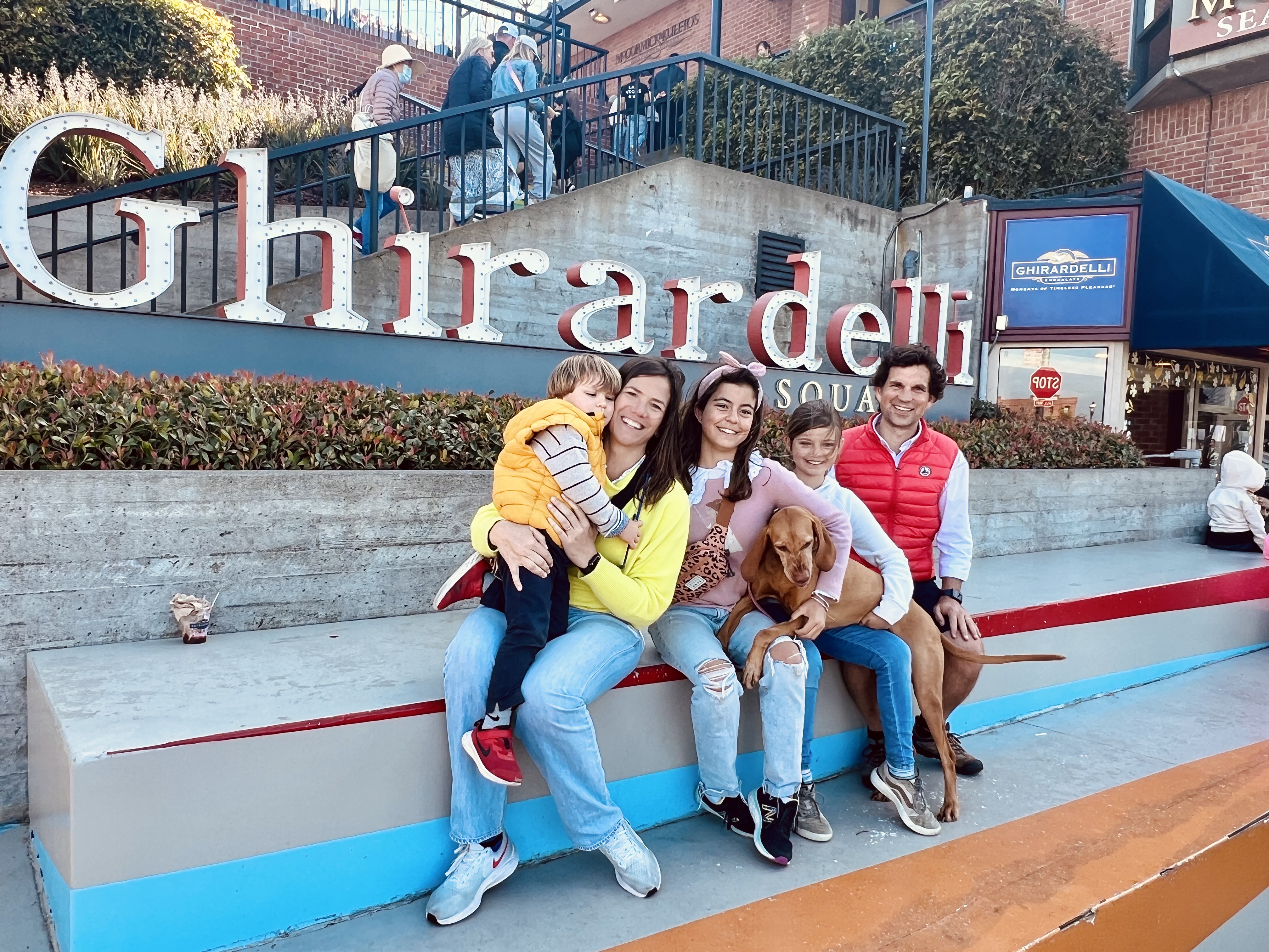 Img: people, person, pants, female, girl, teen, shoe, glove, handbag, road sign
