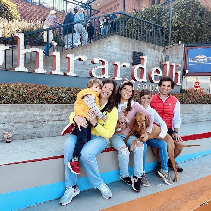Img: people, person, pants, female, girl, teen, shoe, glove, handbag, road sign