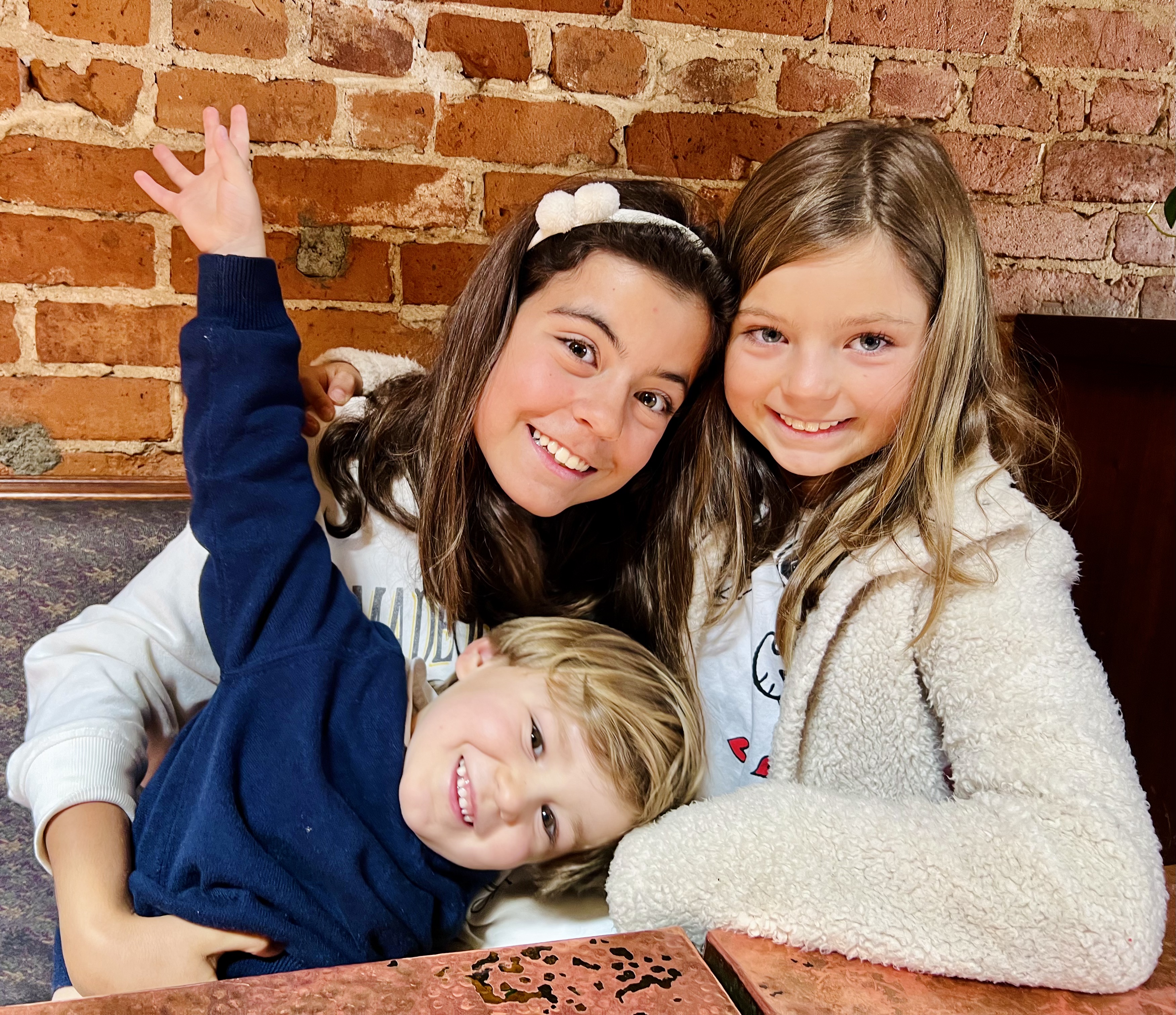 Img: brick, face, head, person, photography, portrait, finger, smile, people, sweater