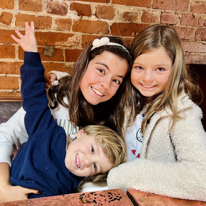 Img: brick, face, head, person, photography, portrait, finger, smile, people, sweater