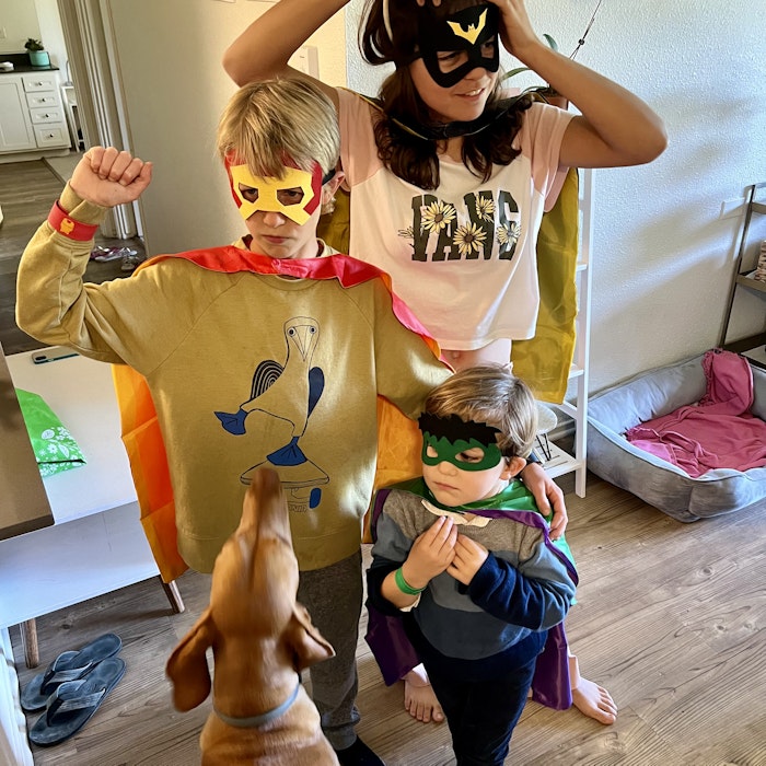 Img: clothing, costume, person, dog, mammal, pet, face, head, photo frame, floor