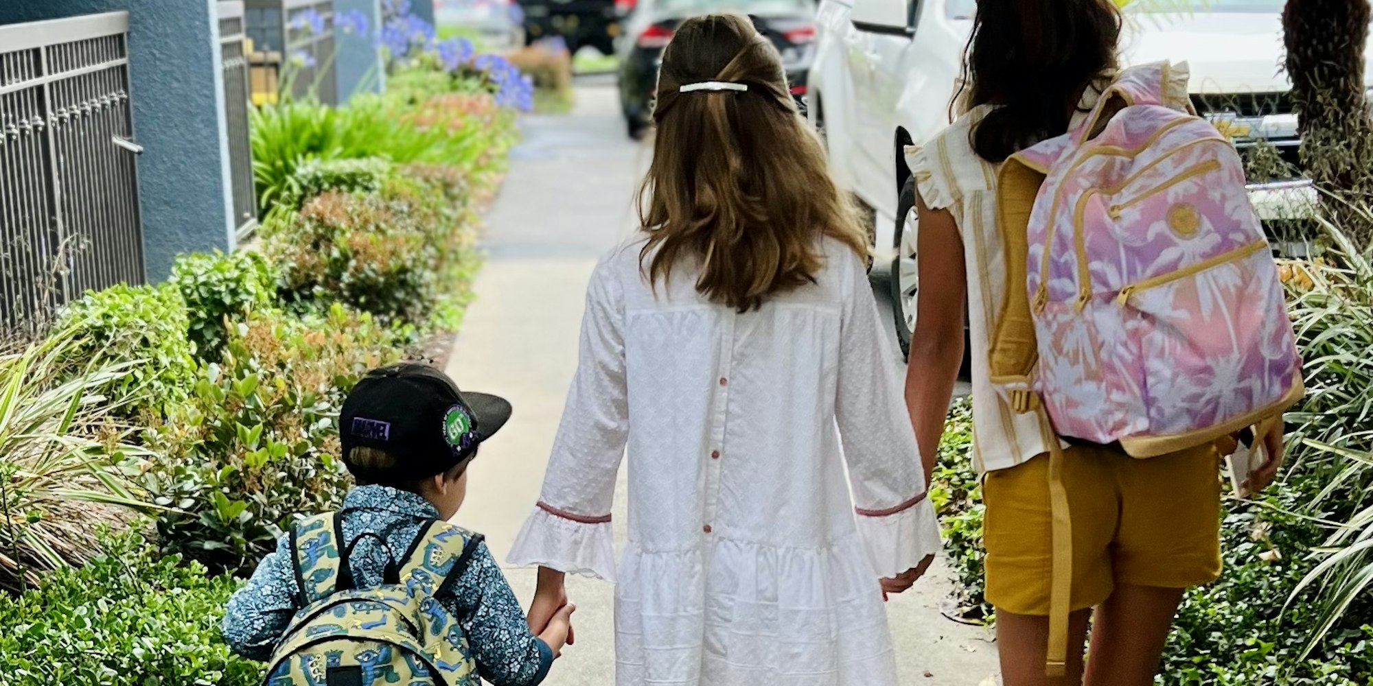Img: person, walking, child, female, girl, pedestrian, bag, shorts, shoe, city