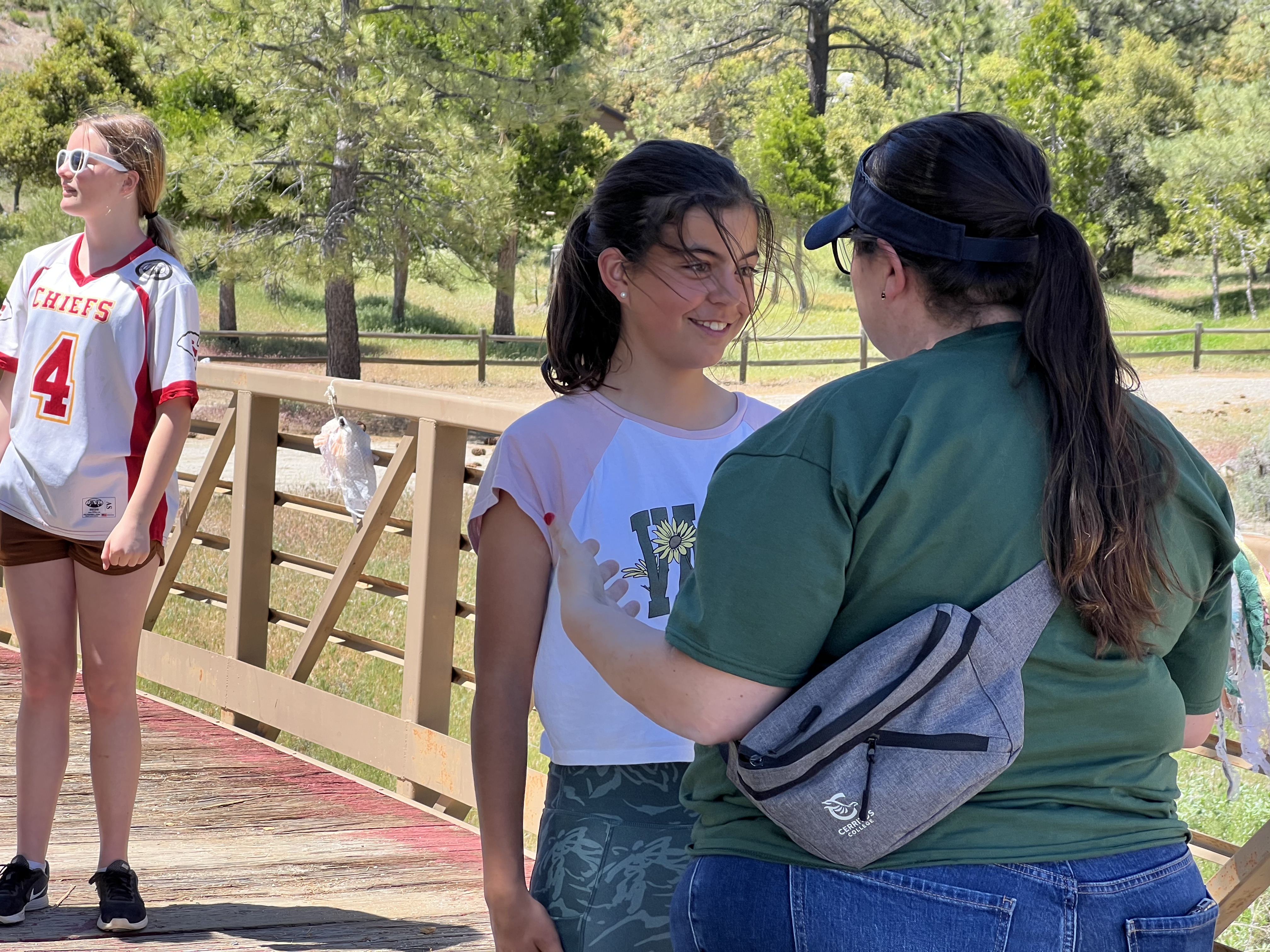 Img: t-shirt, shorts, handbag, park, baseball cap, shoe, boy, male, person, teen
