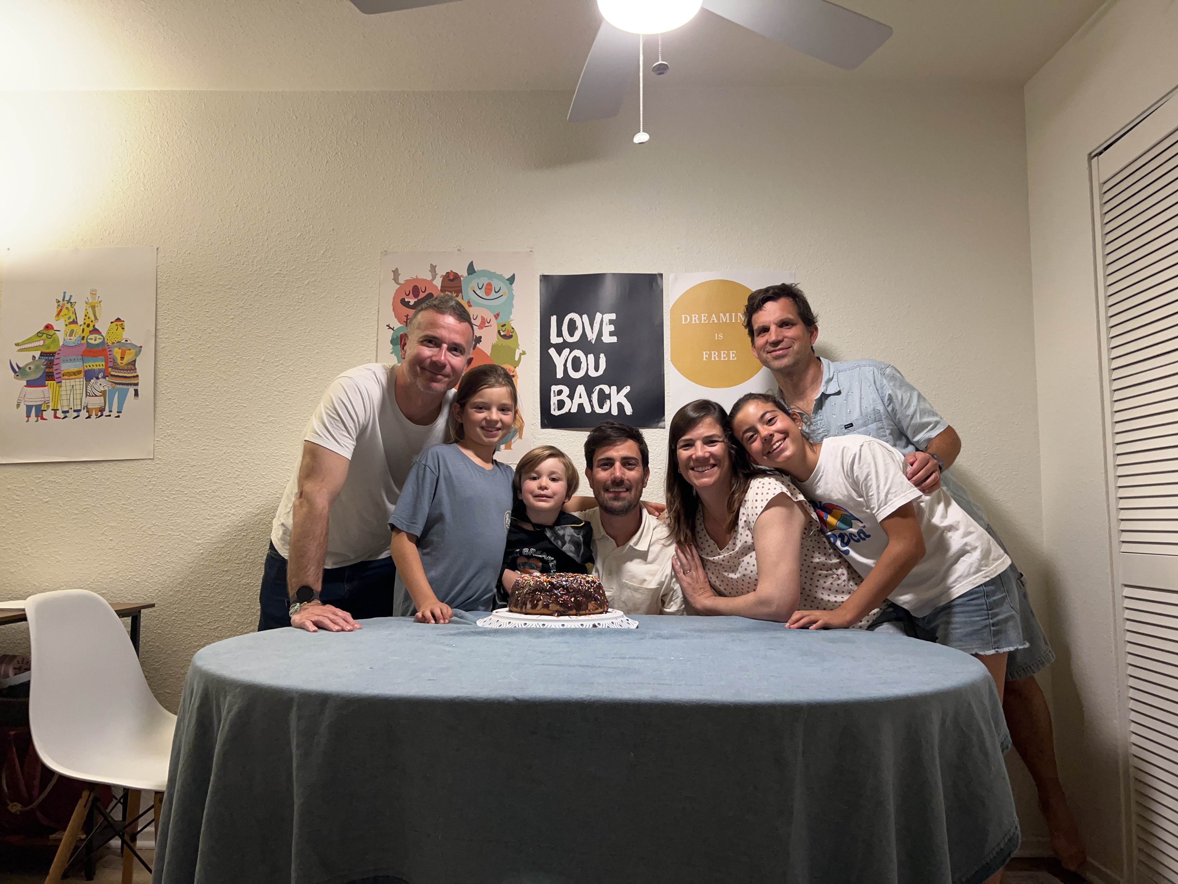 Img: people, person, table, dining room, dining table, birthday cake, portrait, desk, adult, man