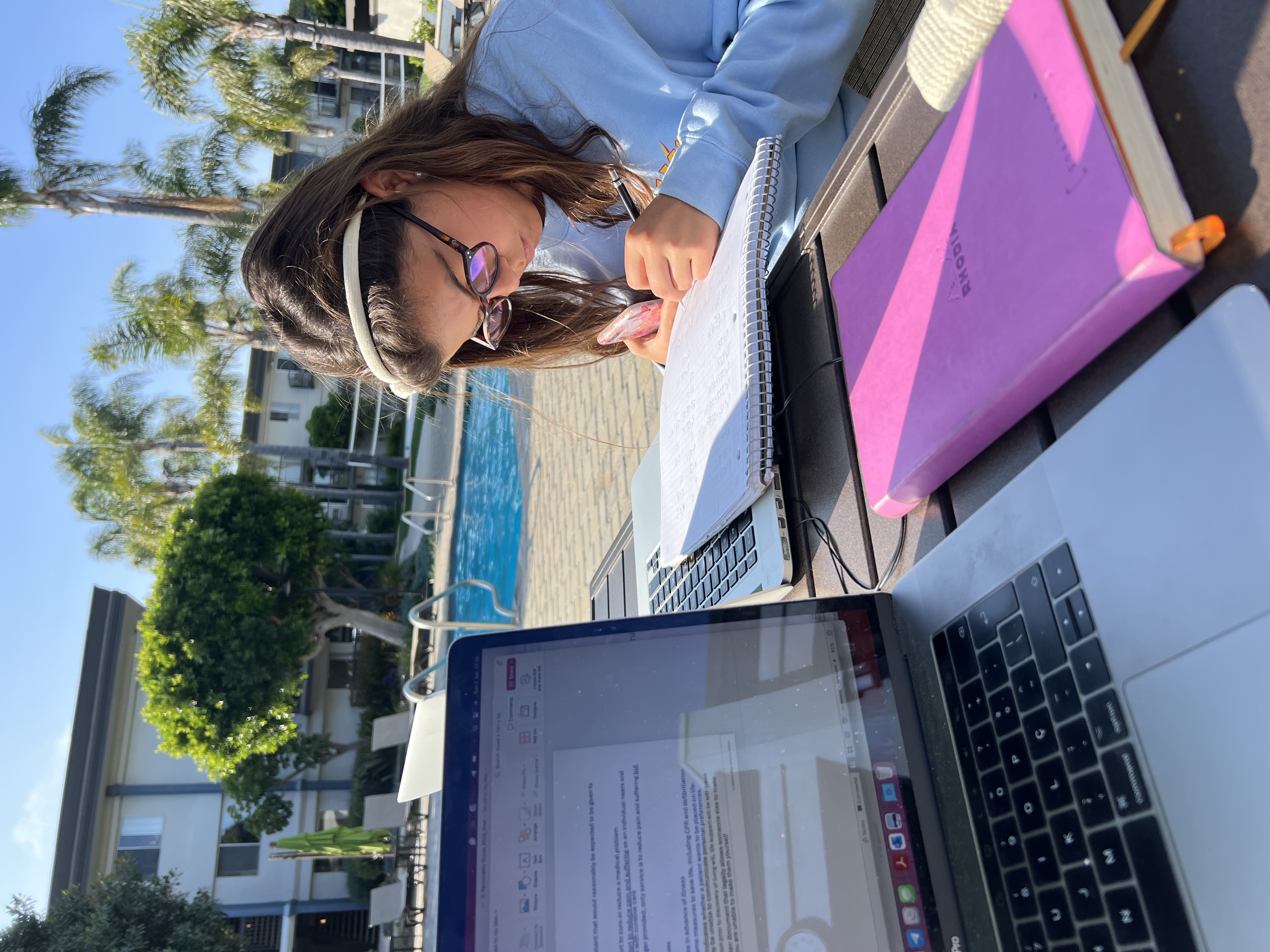 Img: computer, electronics, laptop, pc, person, glasses, table, pen, book, mobile phone