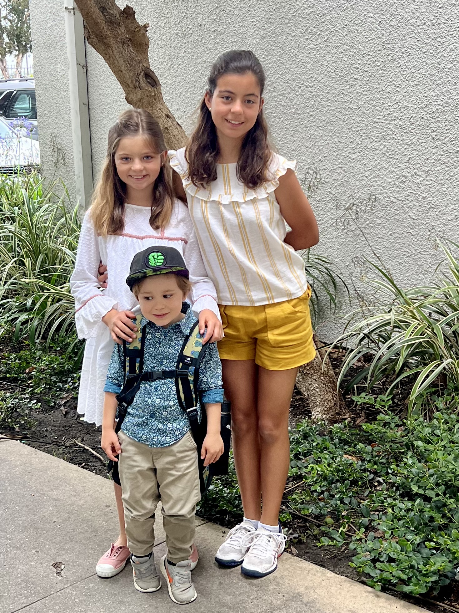 Img: brown hair, hair, person, boy, child, male, people, shorts, car, sleeve