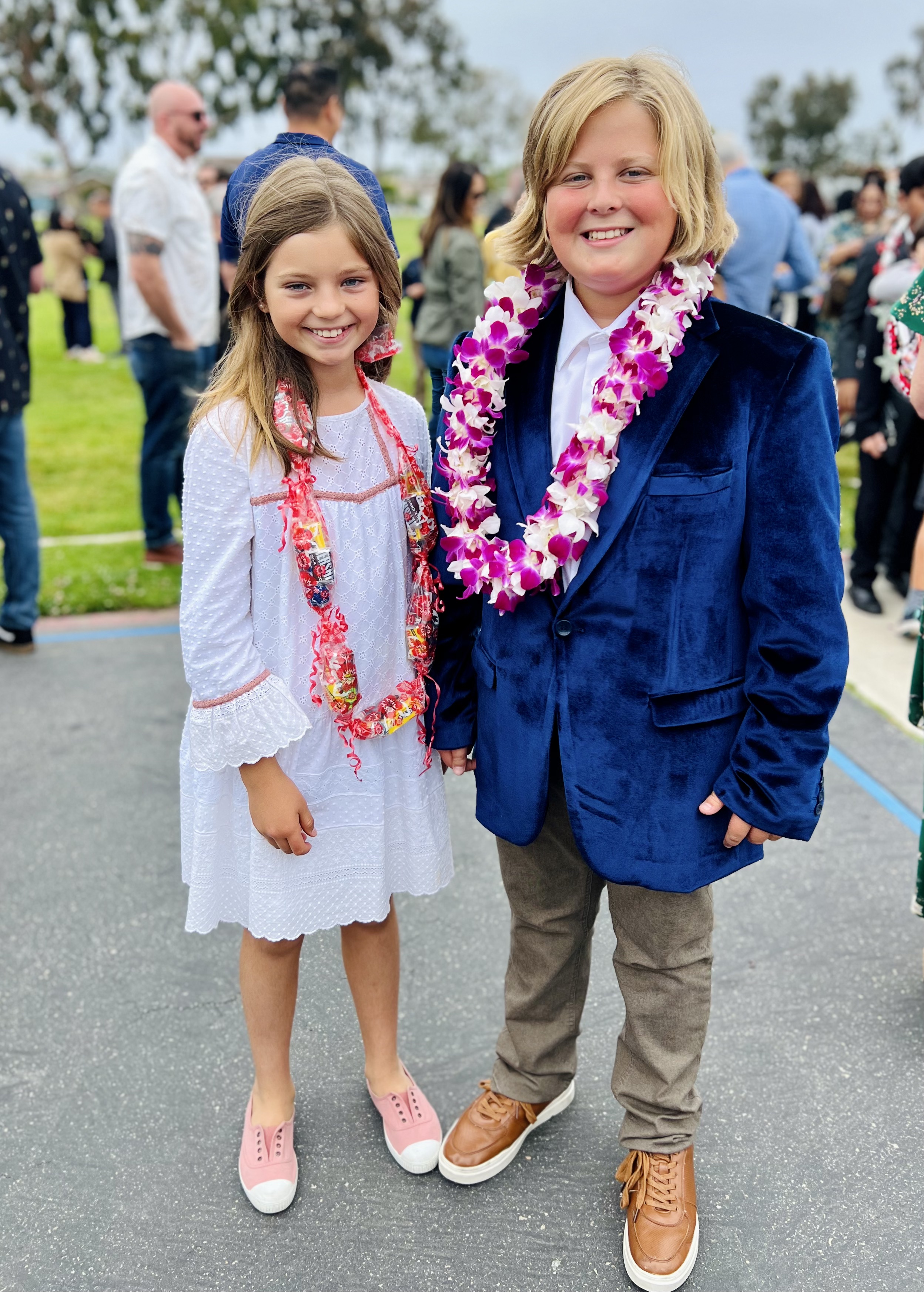 Img: flower, flower arrangement, photography, portrait, pants, accessories, blazer, people, grass, shoe