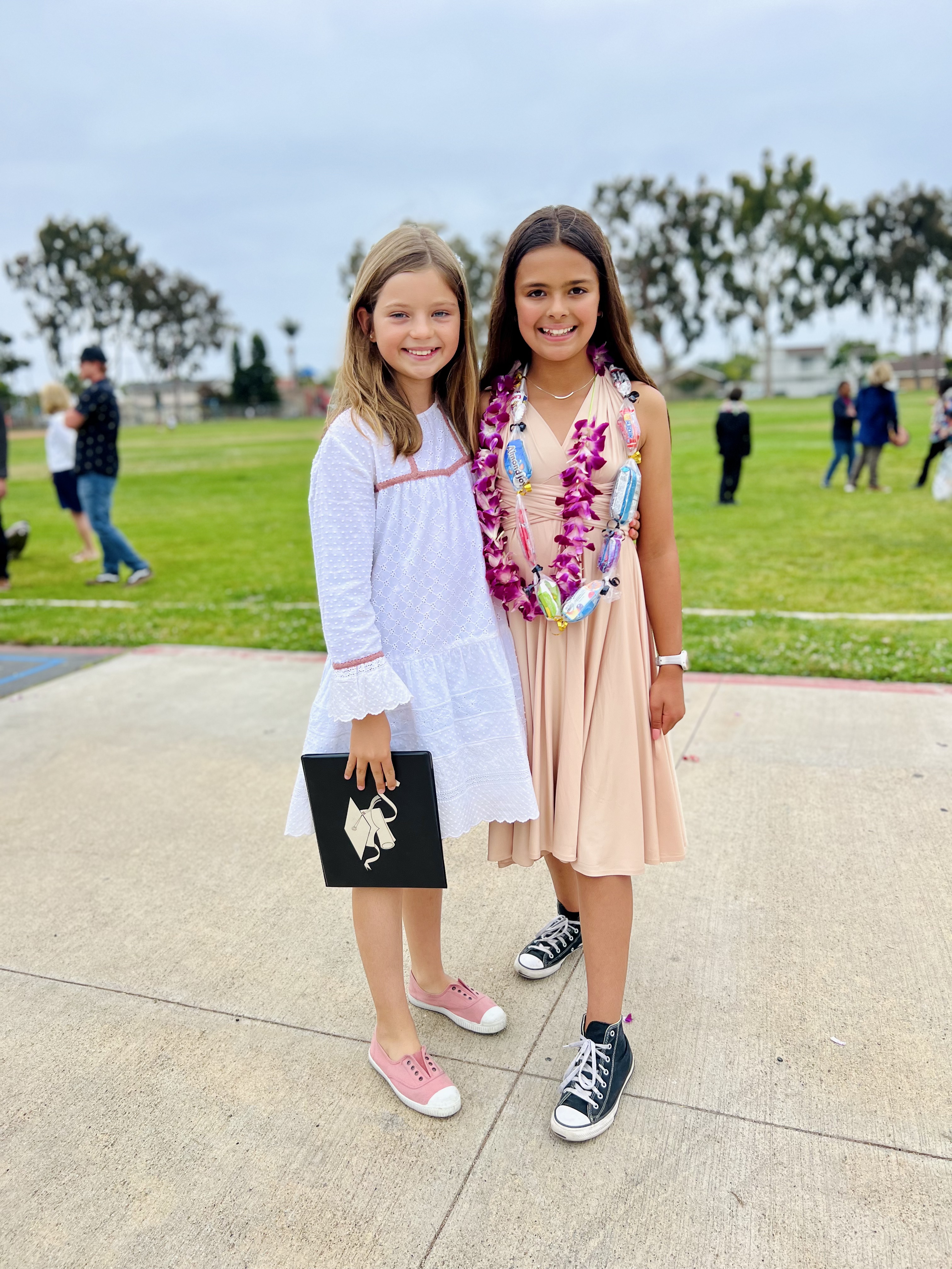 Img: flower, flower arrangement, female, girl, person, teen, grass, shoe, accessories, beachwear