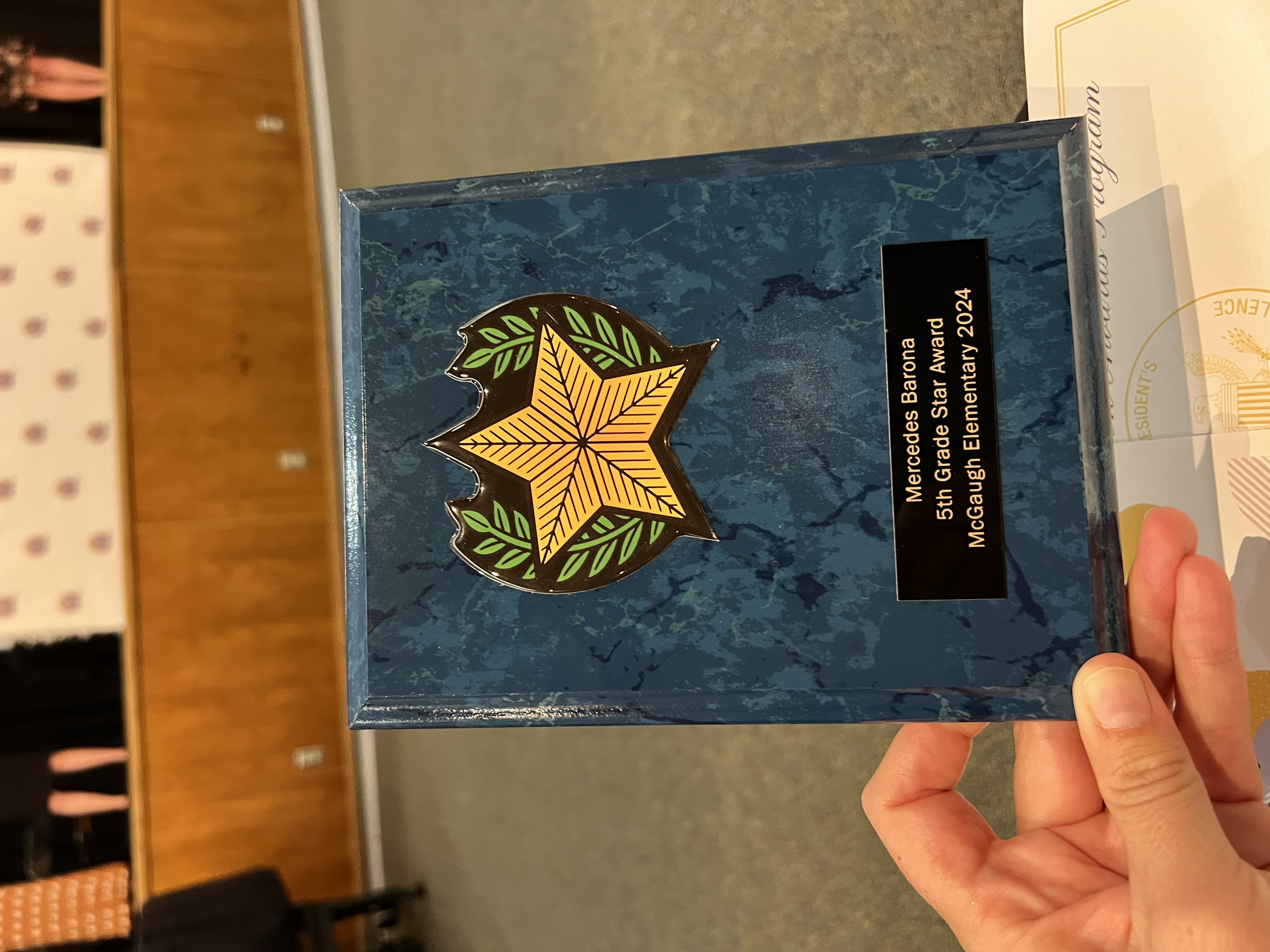 Img: person, business card, paper, text