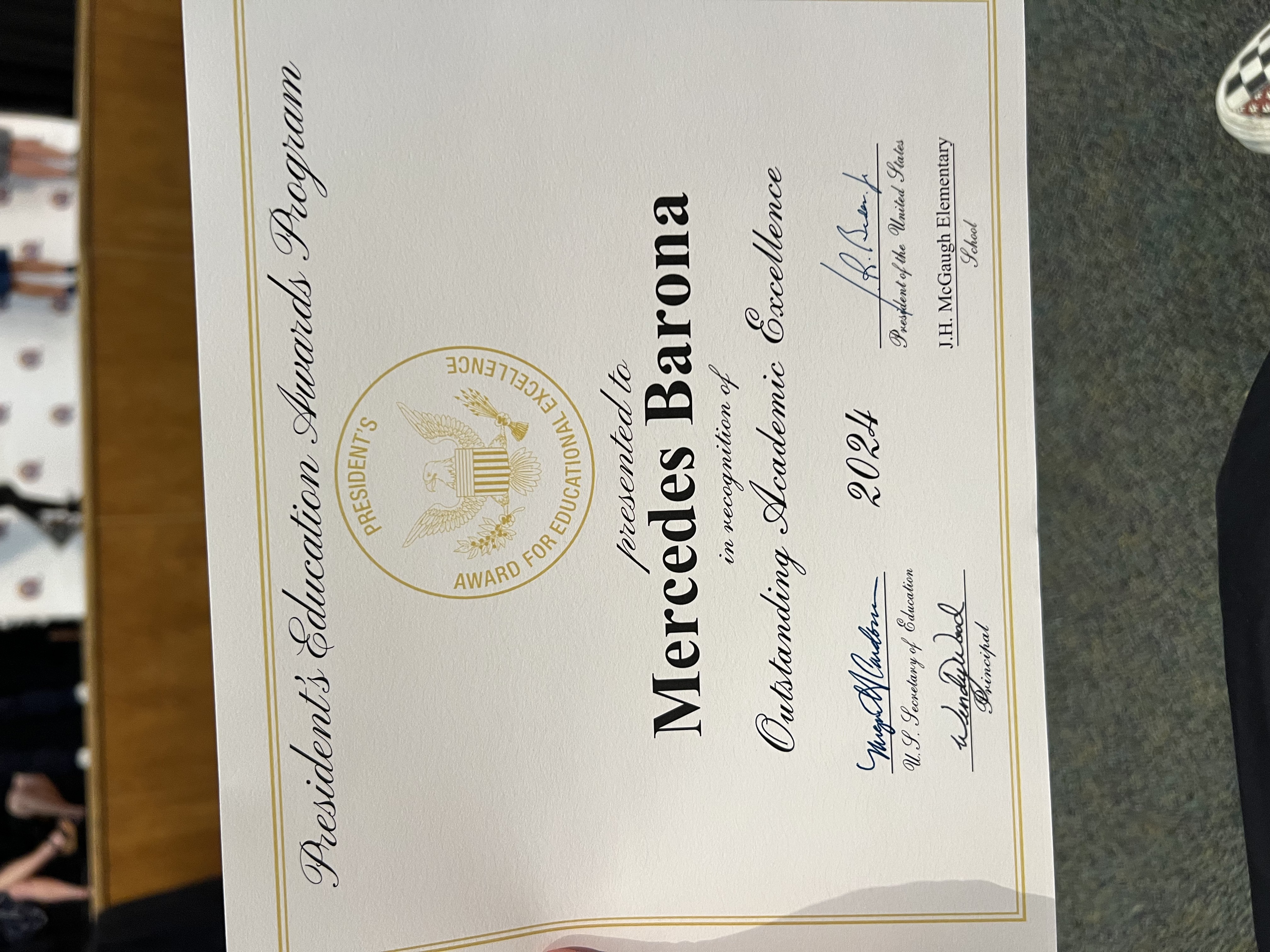 Img: text, diploma, document, business card, paper, person, clothing, footwear, shoe