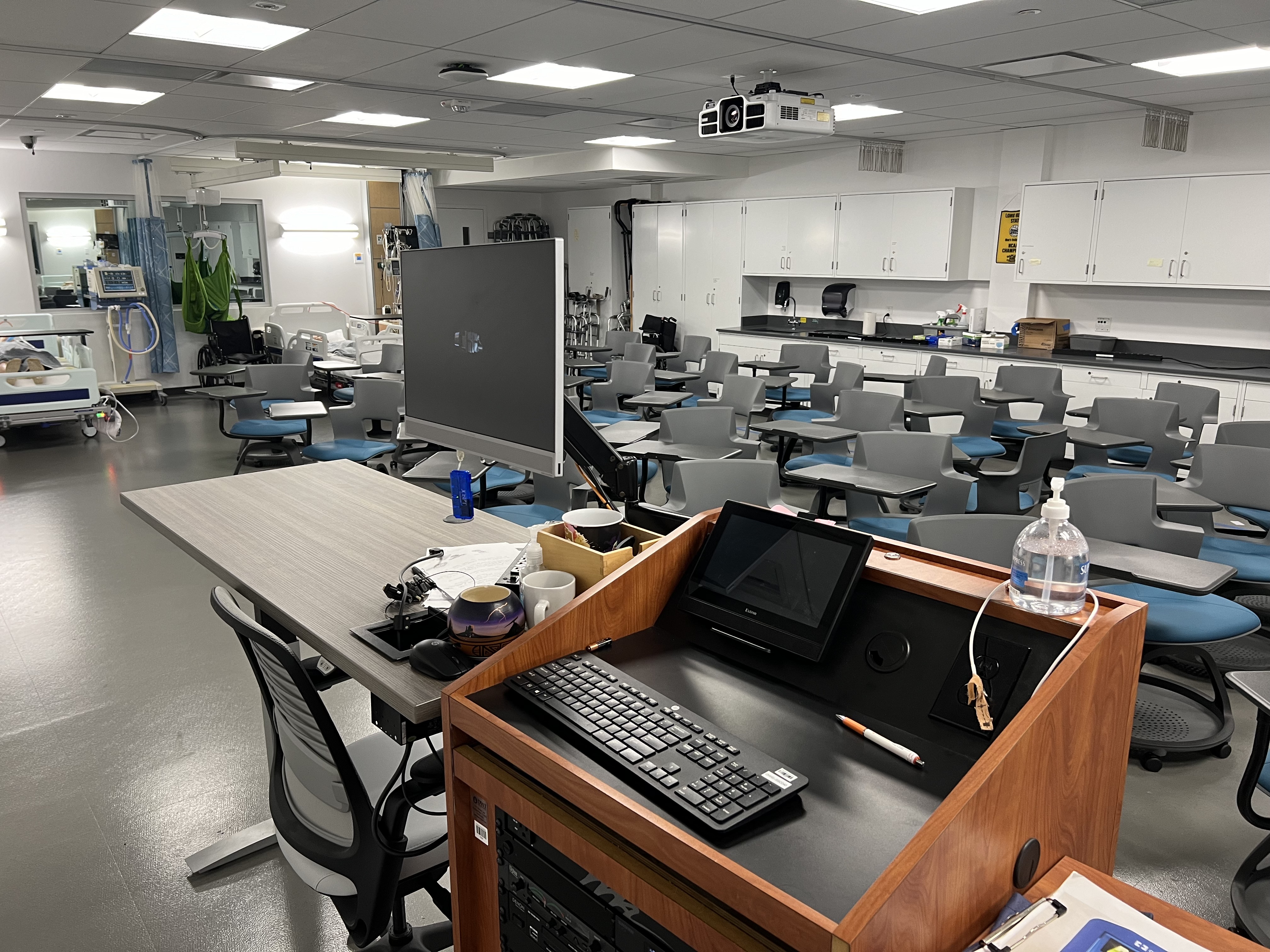 Img: computer keyboard, furniture, table, pen, desk, lab, indoors, monitor, cup, laboratory