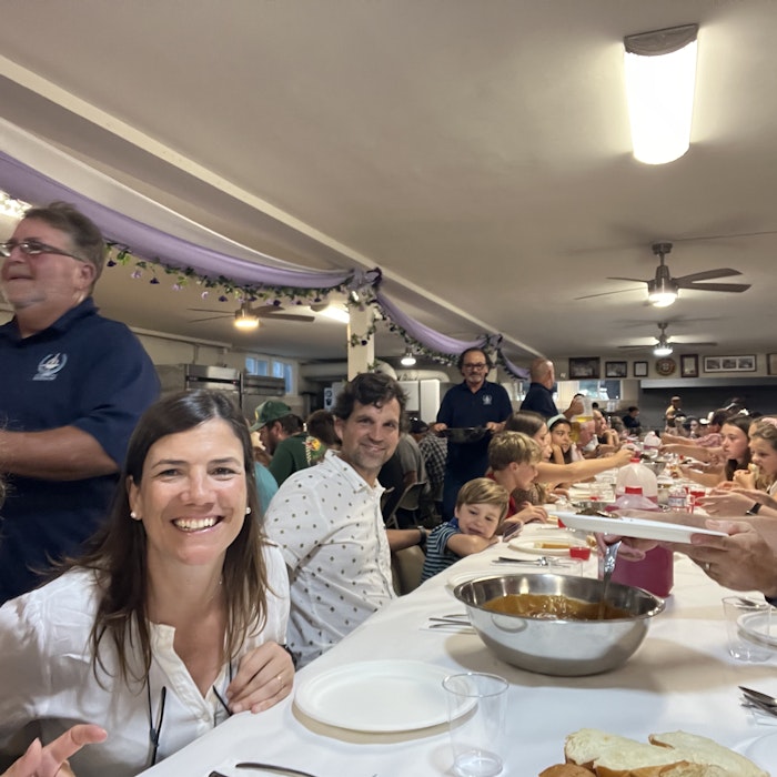 Img: restaurant, adult, female, person, woman, hat, cafeteria, cup, glasses, lamp