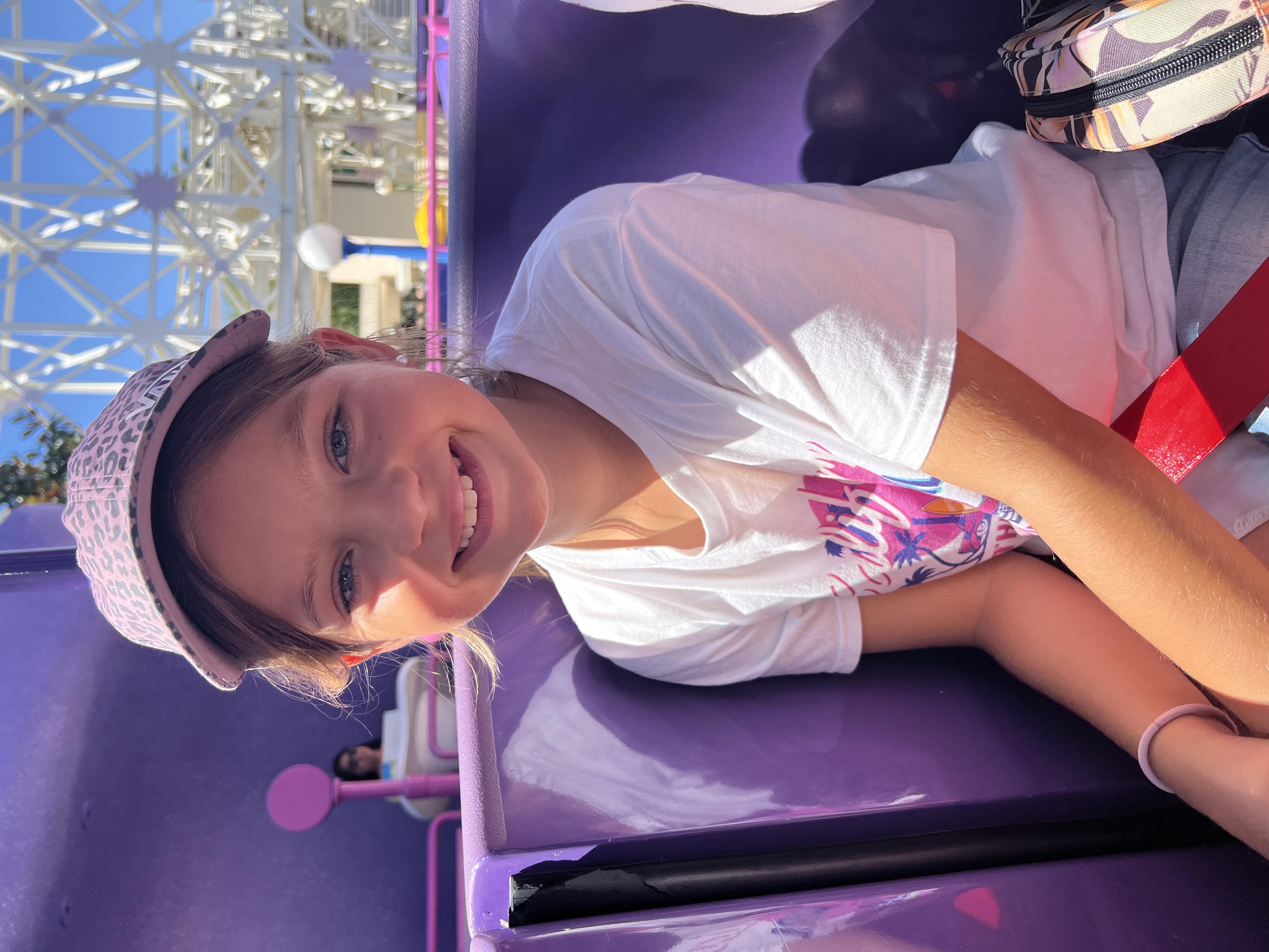 Img: face, head, person, smile, t-shirt, portrait, hat, baseball cap, cap, purple