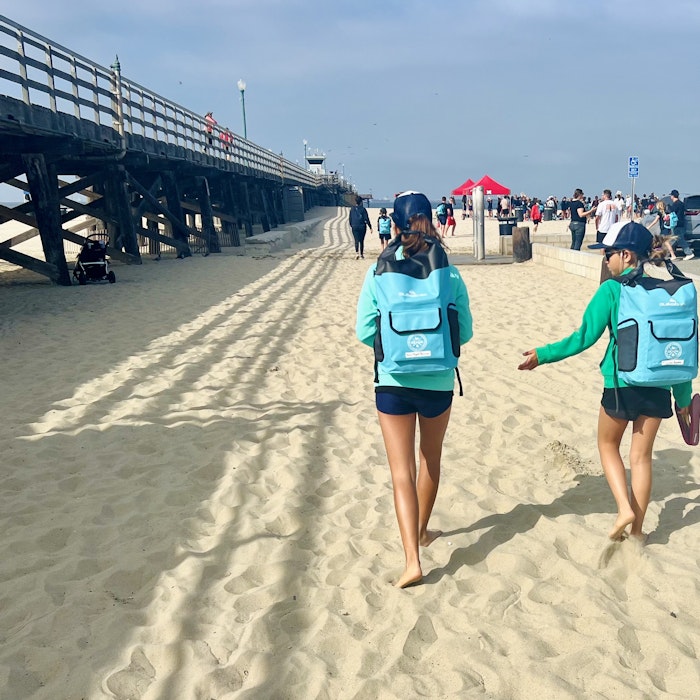 Img: water, waterfront, pier, person, shoe, hat, shorts, vacation, glasses, car