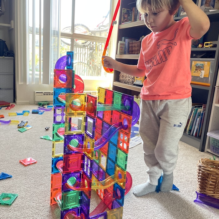 Img: shelf, person, bookcase, furniture, face, head, photography, portrait, indoors, interior design