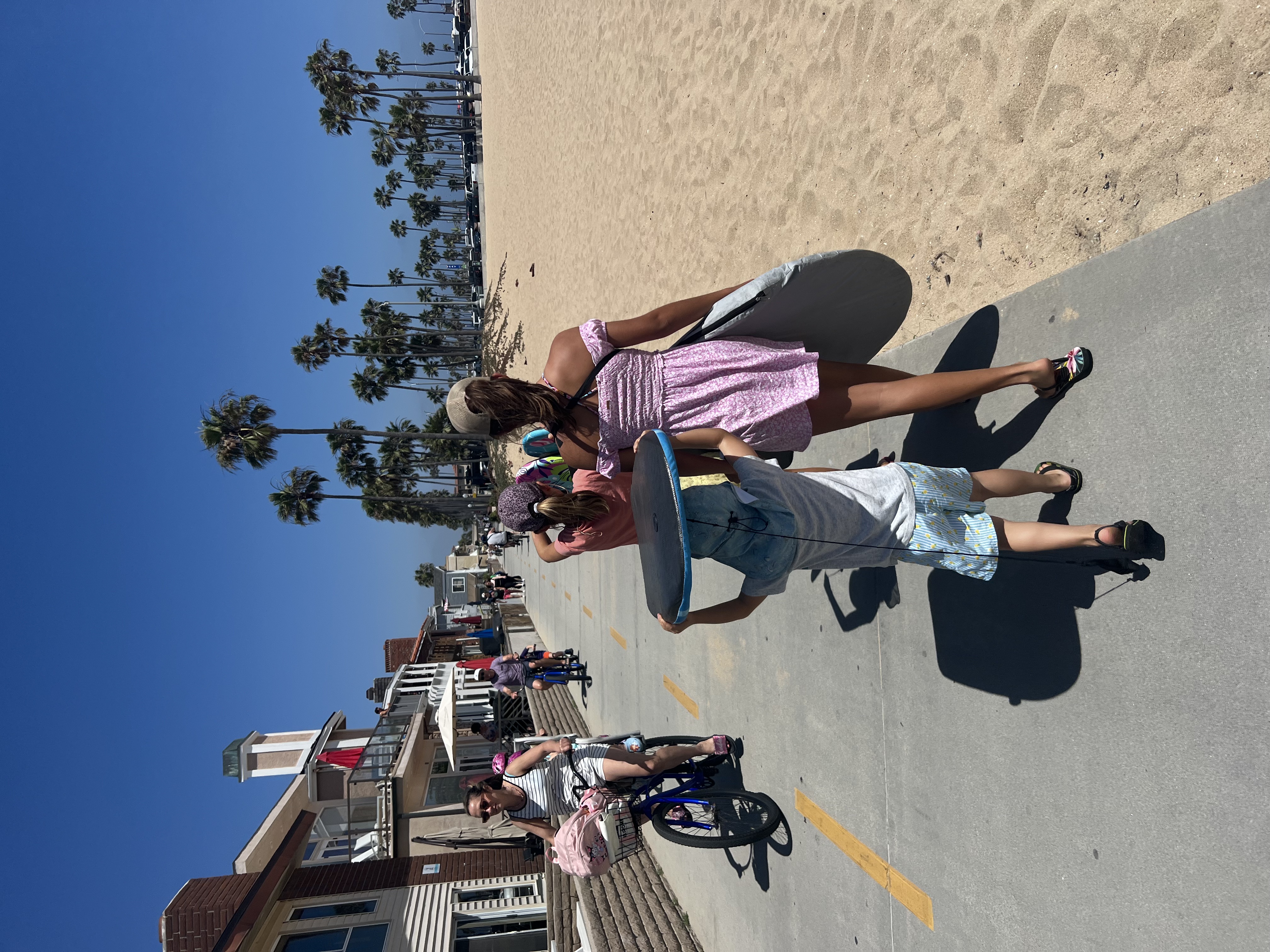 Img: shorts, summer, street, neighborhood, helmet, sea, adult, female, person, woman