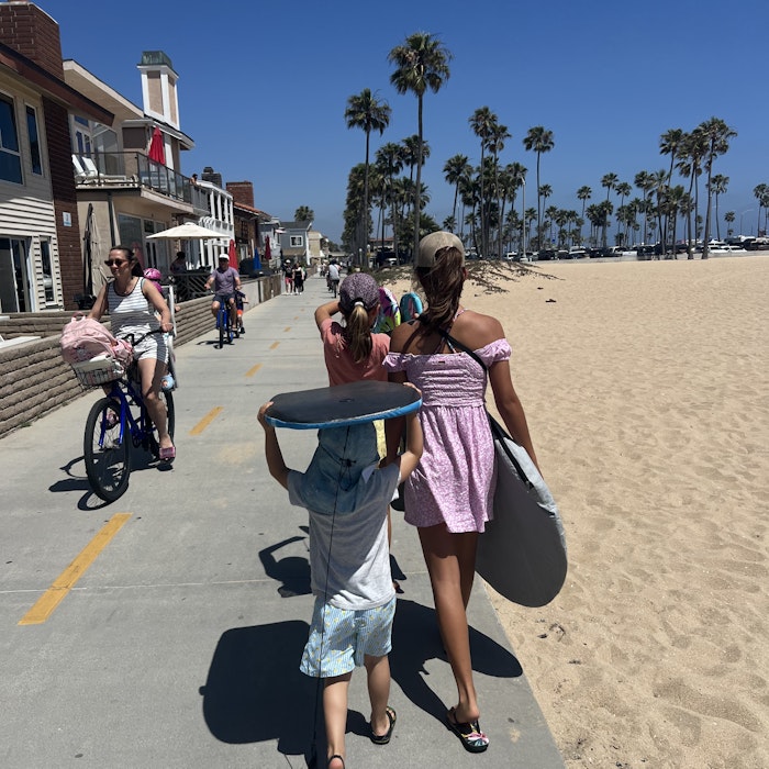 Img: shorts, summer, street, neighborhood, helmet, sea, adult, female, person, woman