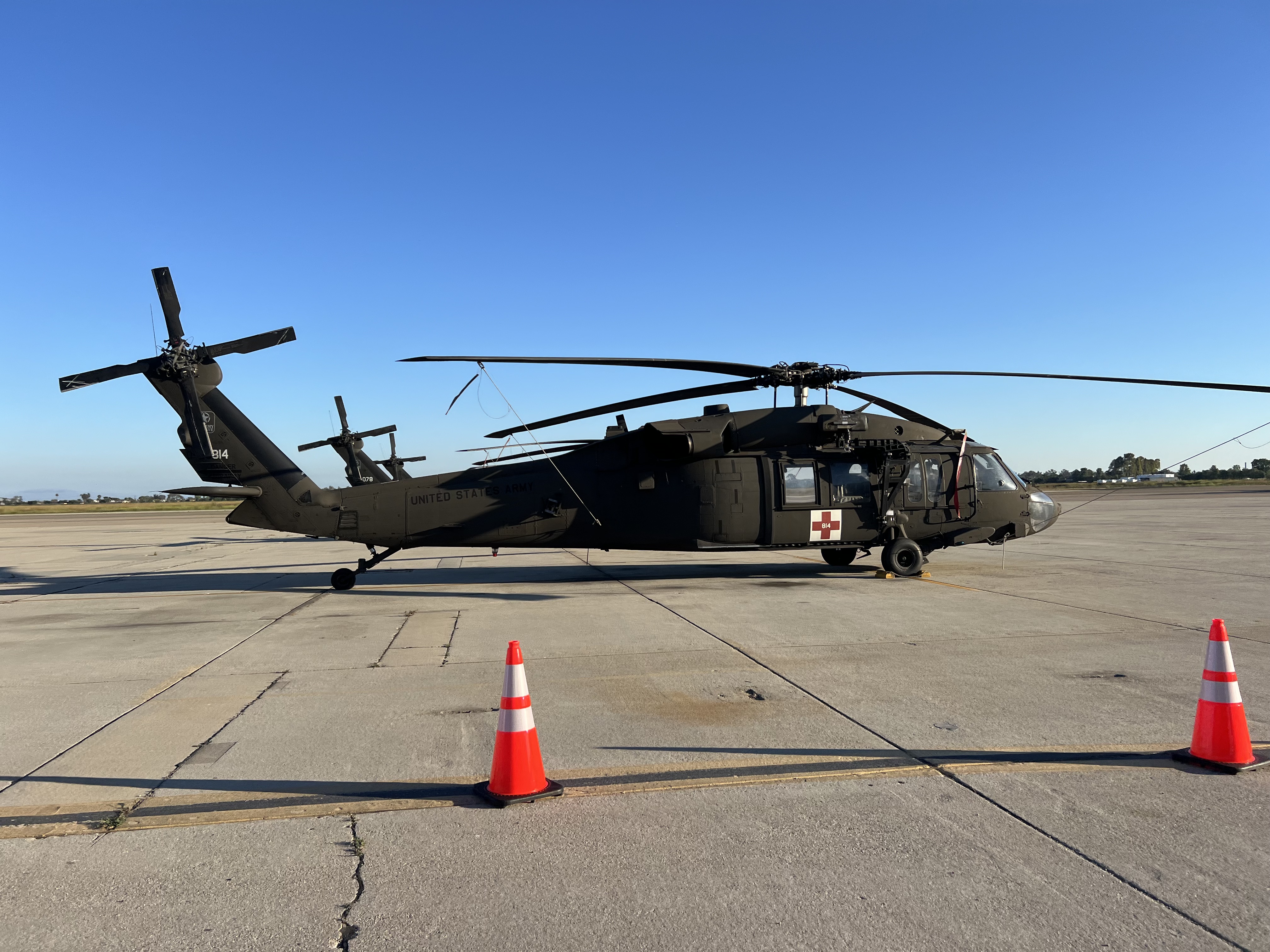 Img: airport, airfield, aircraft, helicopter, transportation, vehicle, helmet, person