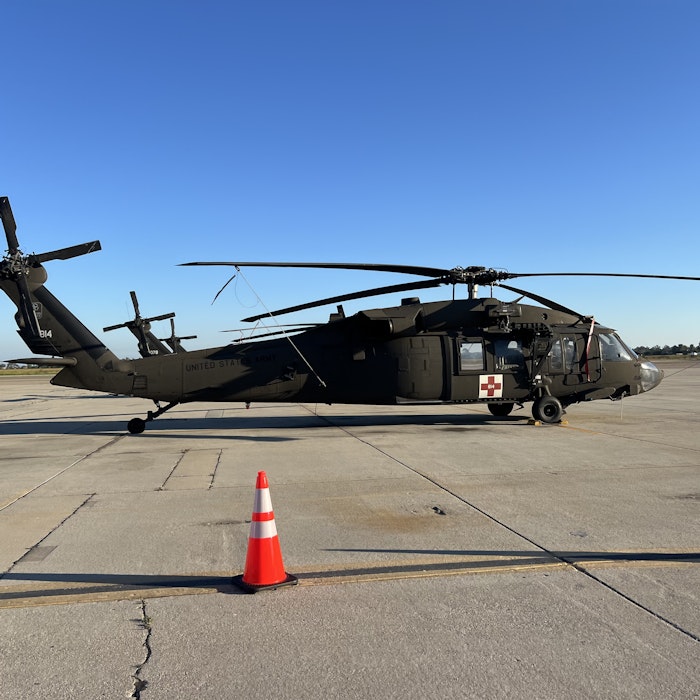 Img: airport, airfield, aircraft, helicopter, transportation, vehicle, helmet, person