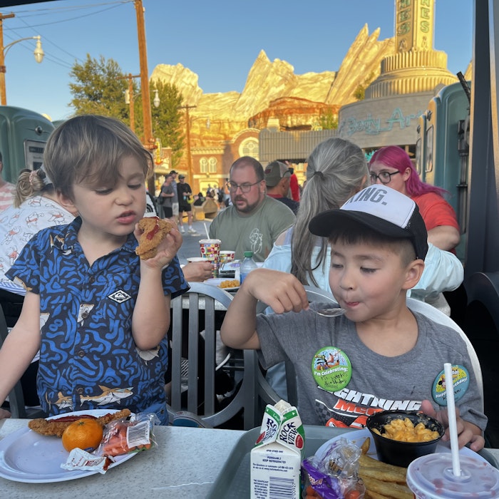 Img: lunch, restaurant, hat, adult, female, person, woman, glasses, boy, child