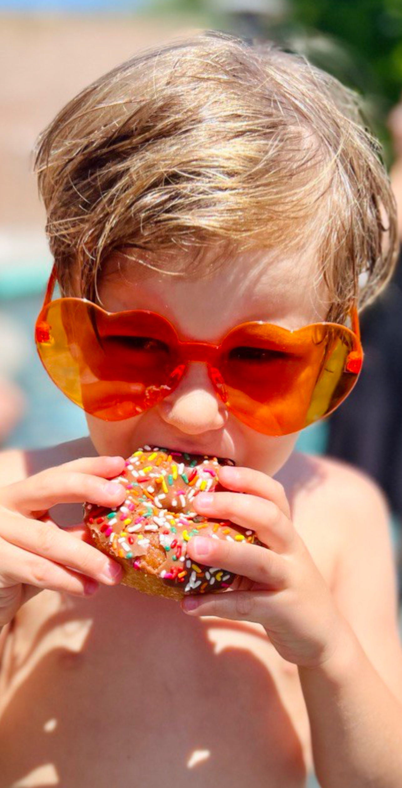 Img: accessories, sunglasses, person, head, face, finger, portrait, eating, food, sweets