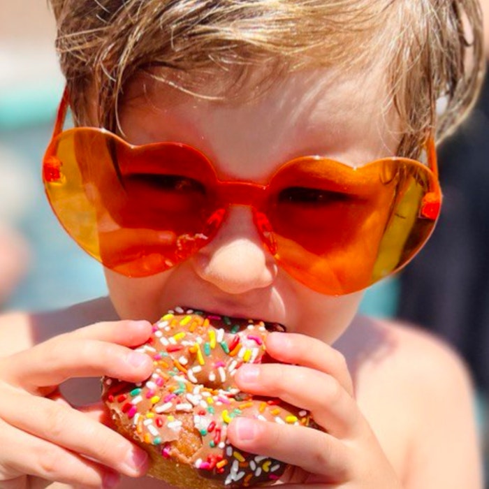 Img: accessories, sunglasses, person, head, face, finger, portrait, eating, food, sweets