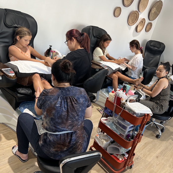 Img: adult, female, person, woman, indoors, handbag, beauty salon, glasses, wristwatch, chair