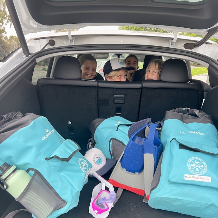 Img: person, clothing, hat, bag, handbag, chair, car, fun, vacation, car trunk