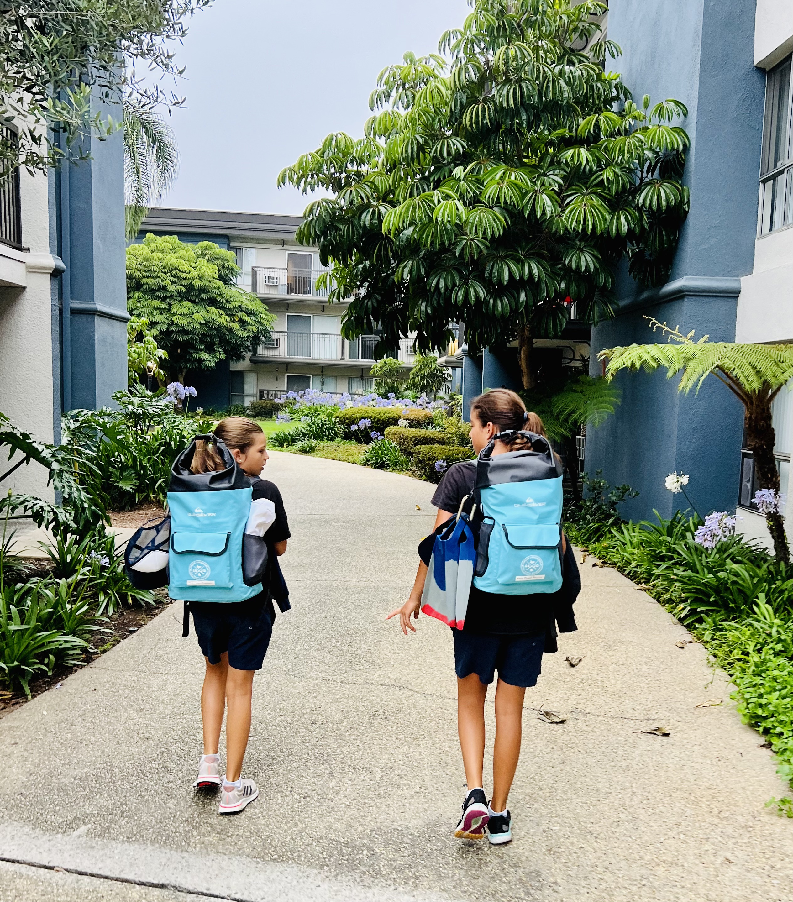 Img: person, walking, shorts, bag, city, shoe, child, female, girl, handbag