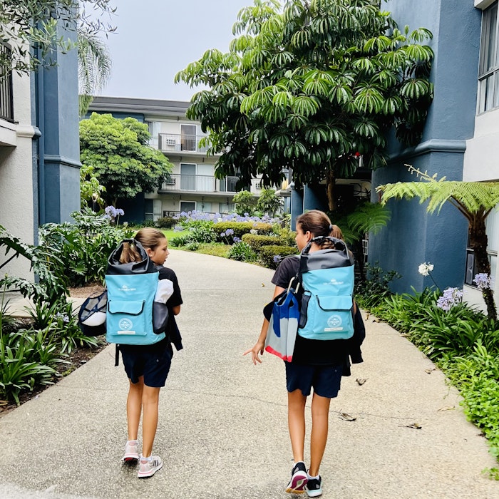 Img: person, walking, shorts, bag, city, shoe, child, female, girl, handbag