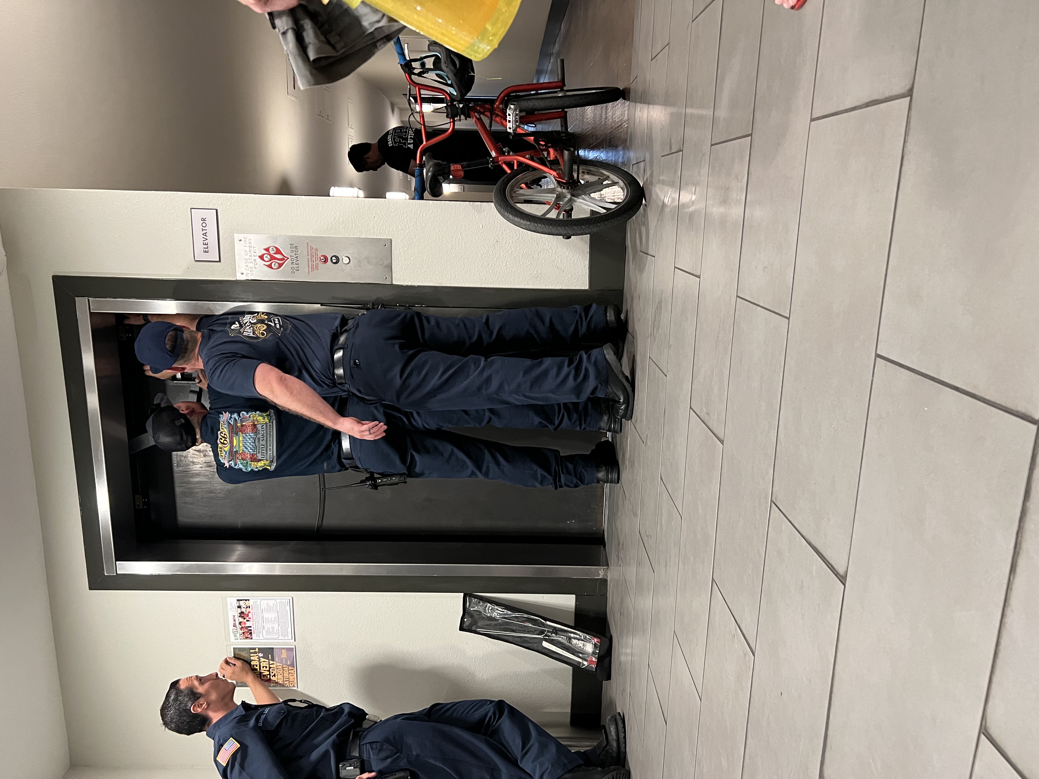 Img: floor, shoe, adult, male, man, person, bicycle, belt, handbag, wheel