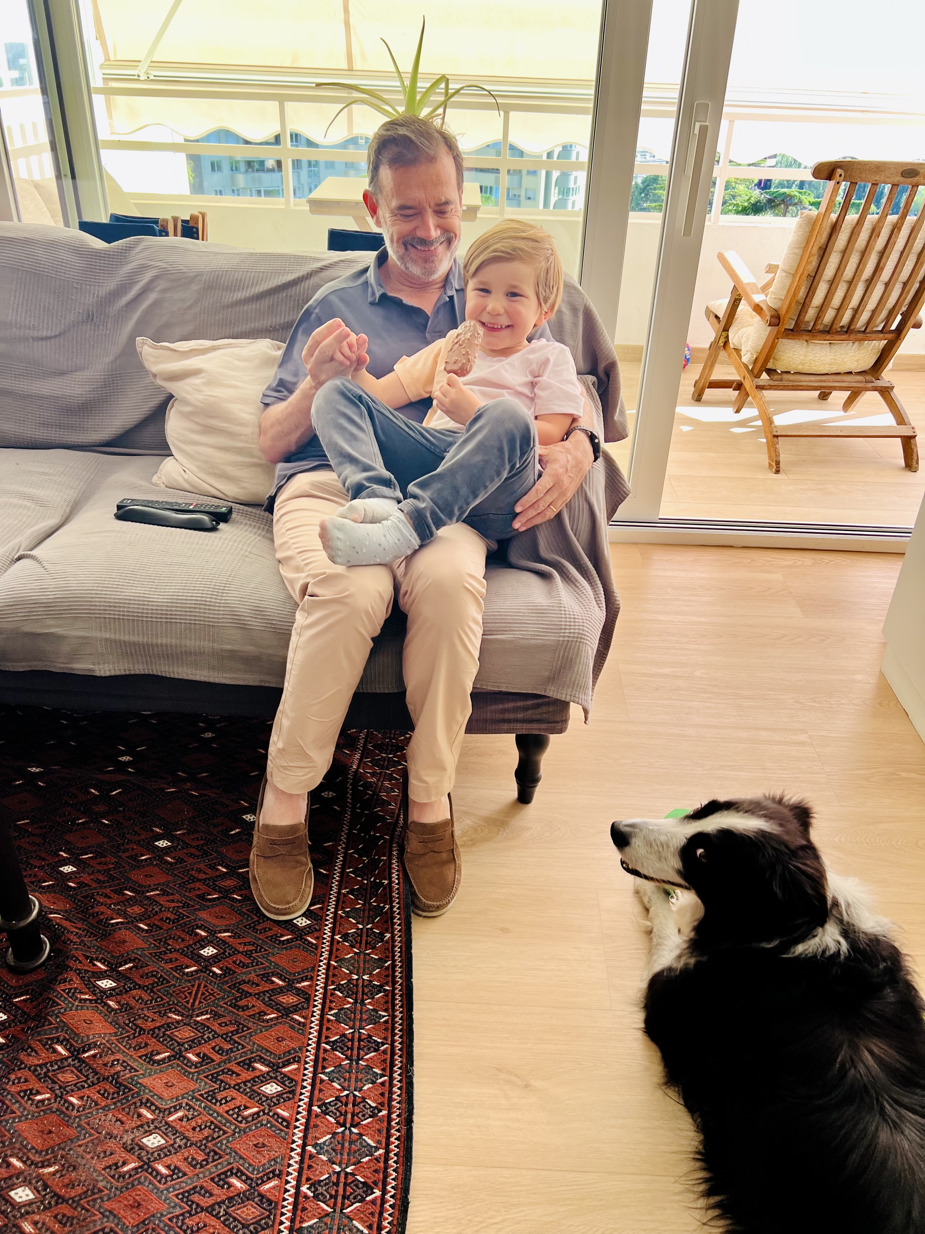 Img: couch, furniture, living room, pants, photography, portrait, floor, flooring, wood, interior design