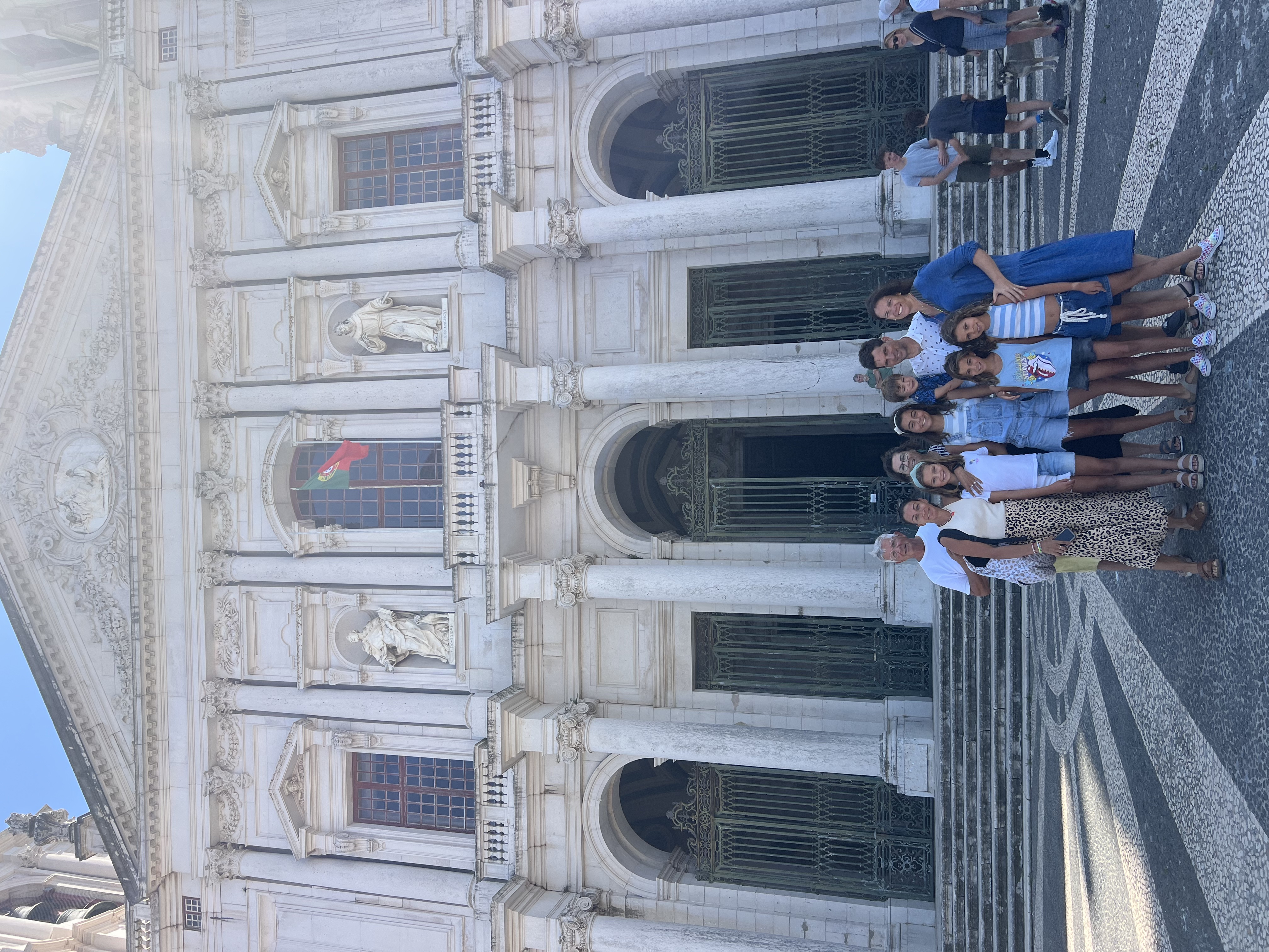 Img: shorts, people, person, shoe, handbag, hat, flag, arch, skirt, urban