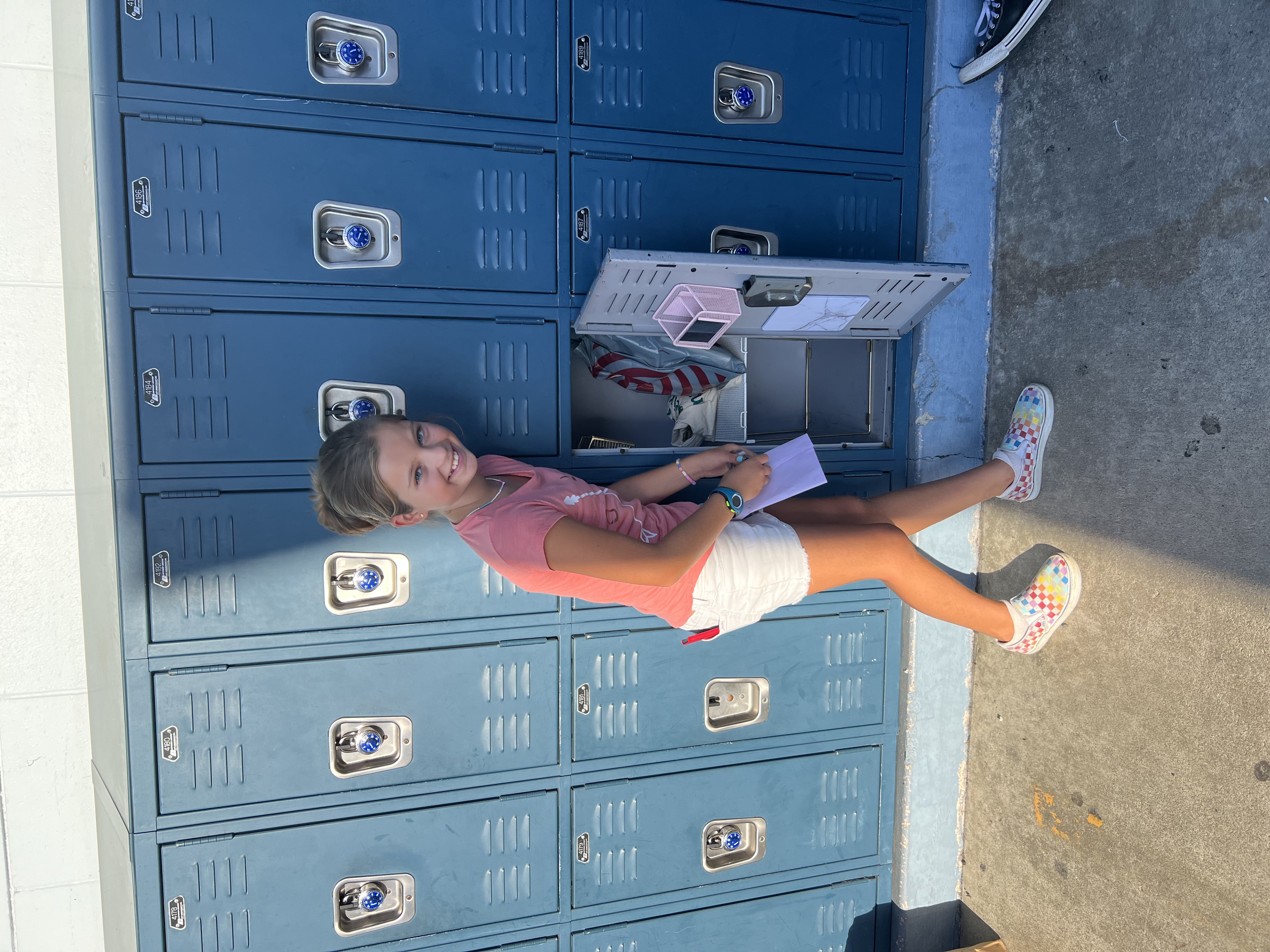 Img: clothing, footwear, shoe, shorts, person, portrait, locker, sneaker, wristwatch, pants