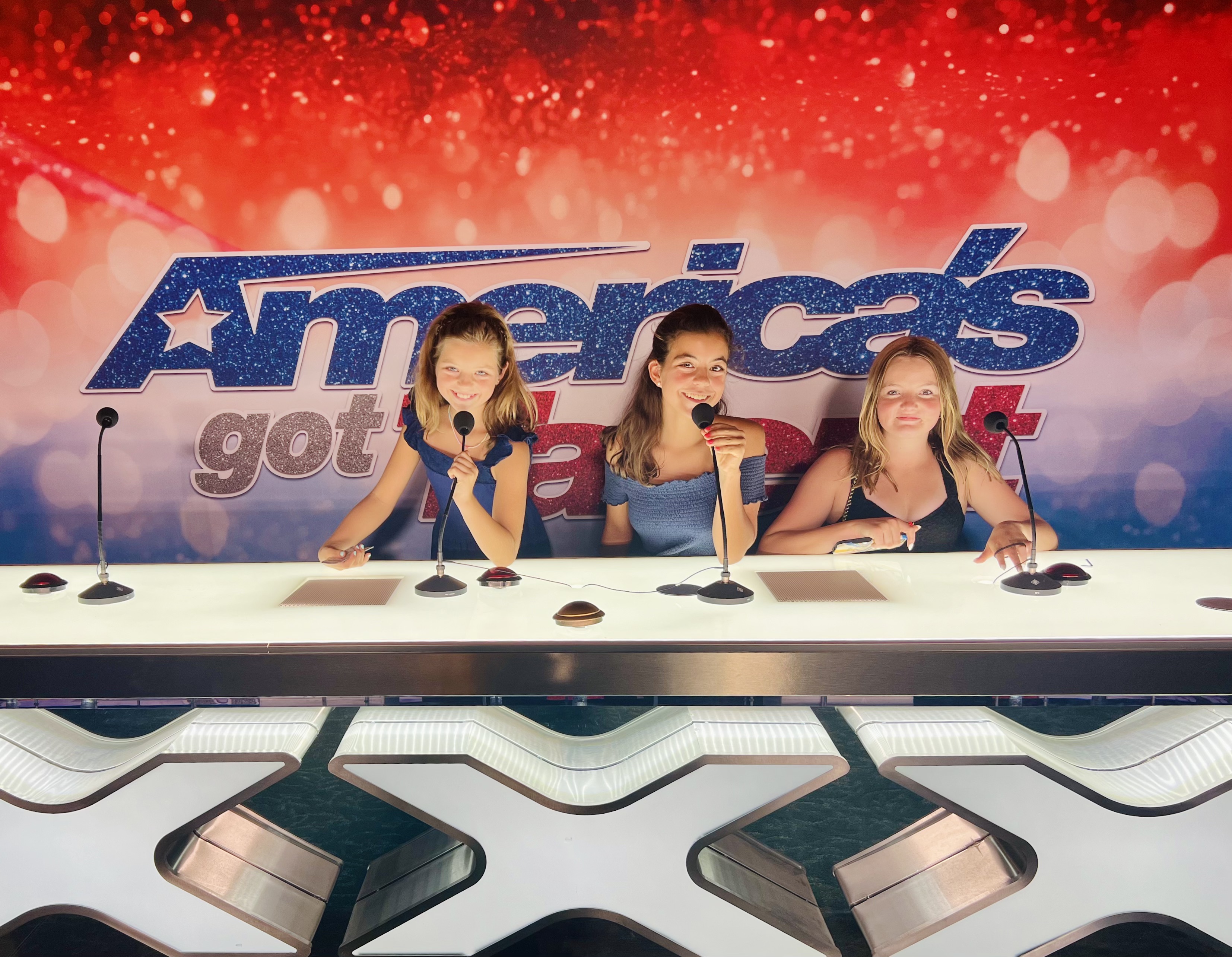 Img: person, adult, female, woman, electrical device, microphone, reality show judges panel