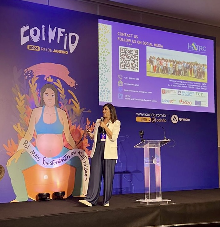 278c2d6e D8b4 4db4 B36a 6cdb82c9edfb: crowd, person, audience, adult, female, woman, speech, podium, face, qr code