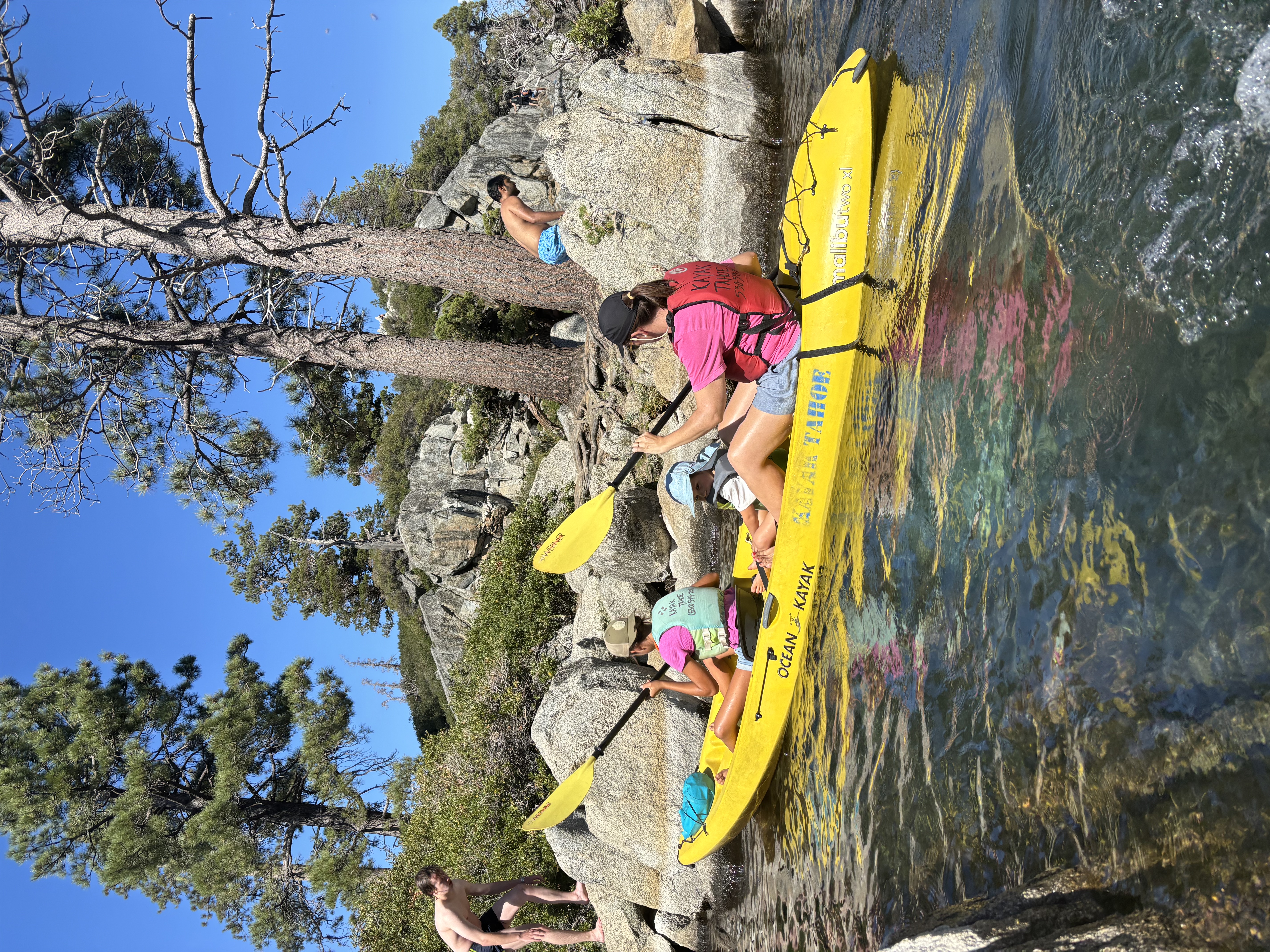 Img: rock, water, lifejacket, vest, person, boat, vehicle, kayak, rowboat, hat