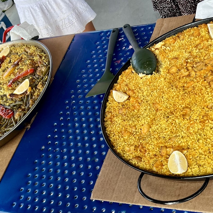 Img: food, food presentation, paella, cutlery, spoon, person, child, female, girl, box