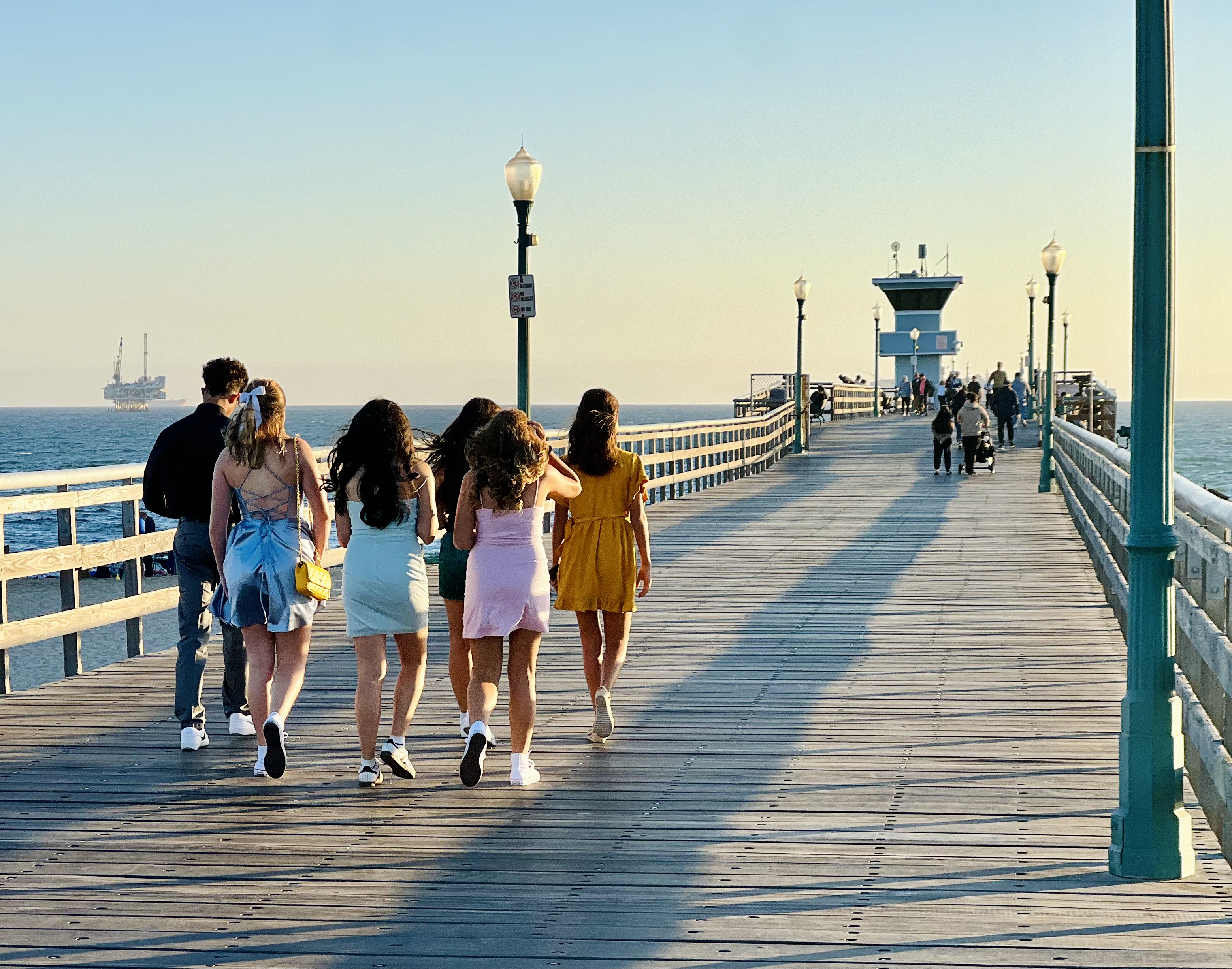 Img: water, waterfront, pier, boardwalk, person, walking, shoe, handbag, path, shorts