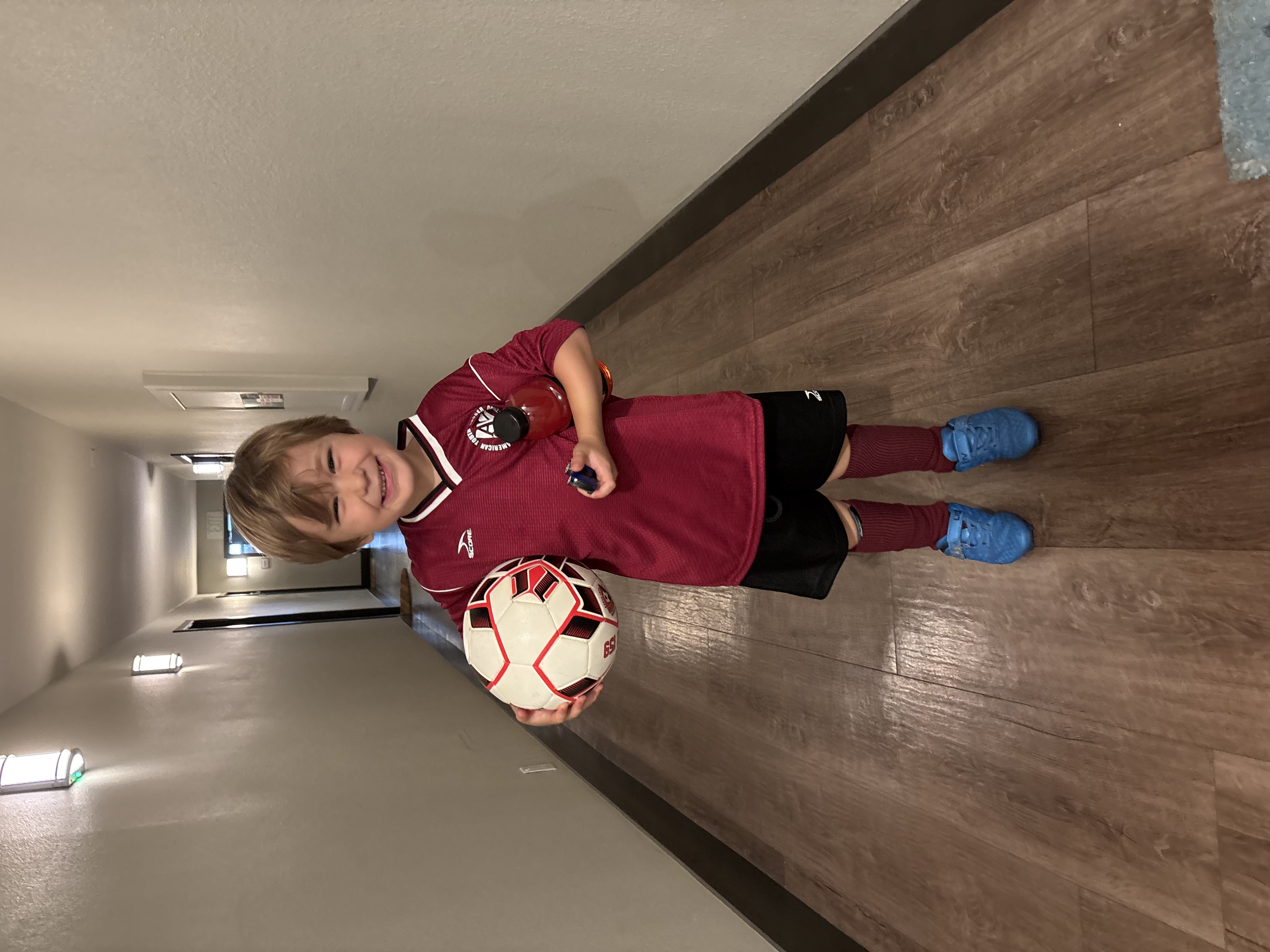 Img: soccer ball, floor, flooring, sphere, hardwood, wood, boy, child, male, person